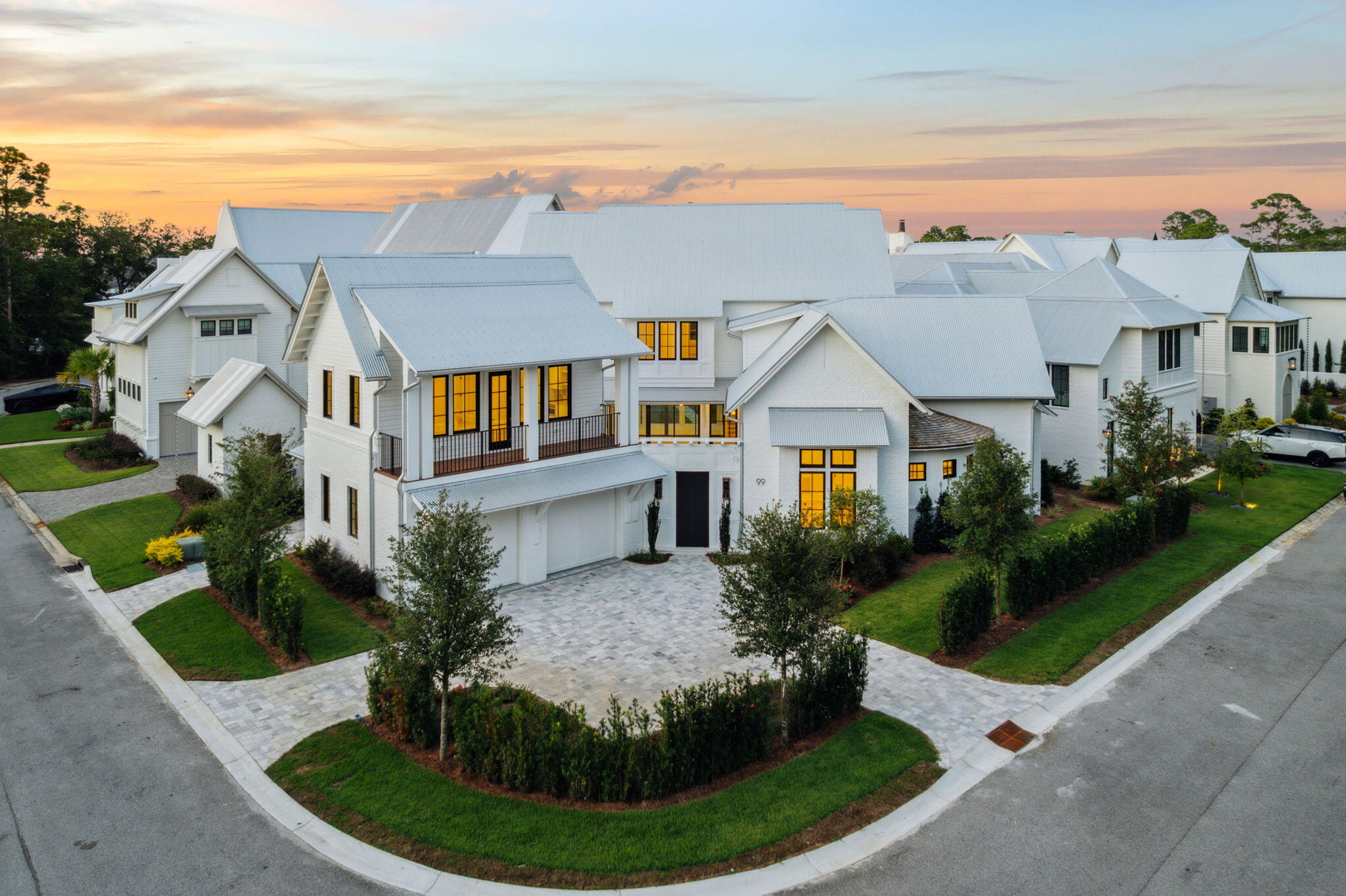 99 Perrin stands as a newly completed lakefront estate within the coveted enclave of Churchill Oaks, where Southern architectural tradition meets refined modern craftsmanship in the heart of Santa Rosa Beach.Spanning more than 5,600 square feet across three elegant levels, the residence offers five bedrooms, five full baths, and two half baths, each space designed with a discerning eye toward proportion, natural light, and seamless flow. Expansive porches extend living outward, while a private pool anchors the outdoor retreat. A two-car garage, plus separate golf cart garage completes the layout, balancing quiet comfort with effortless entertaining.What defines this home is its setting. Churchill Oaks is more than a neighborhood, it is a private architectural enclave... where over 40 acres of preserved green space integrate nature into daily life. Residents enjoy exclusive amenities including a bayfront clubhouse, resort-style pool, fitness center, and deepwater marina, all thoughtfully designed to cultivate privacy, permanence, and peace.