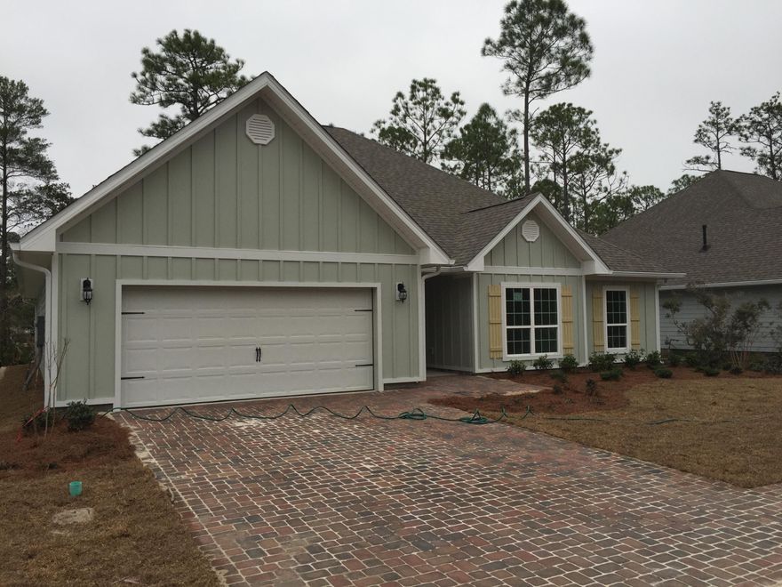 This Wonderful Ranch style home is the largest single story home DR Horton is building south of the Bay in Walton county. Also the only DR Horton Community with Gas Ranges and Gas water heaters standard in he home. This home features a split floorplan with 5 bedrooms and 3 Bathrooms. This home has wood tile throughout the main living areas and the master bedroom and allbathrooms. The kitchen Features Granite countertops, white Maple cabinets, Huge island with a breakfast BAR. The master bath suite will feature a 5 foot tile shower and a sepertae tub. This home is in an ideal location. Tucked back away from all the traffic of 30-a nestled in a small community with oak tree and magnolia and only 3.5 miles to Dune Allen Public Beach Access. THIS HOME WILL BE COMPLETED IN JANUARY.