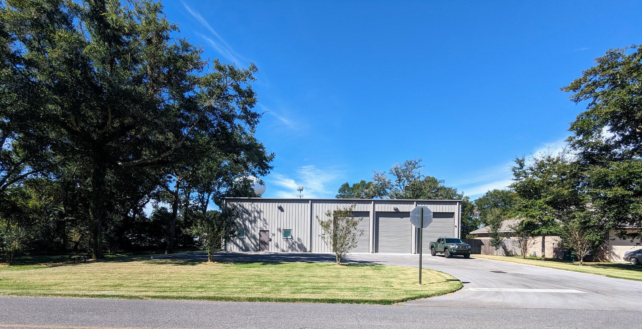 Industrial Warehouse plus office space.  Warehouse has 4016 sq ft on the first floor plus 784 sq ft of office space and 784 sq ft of storage above the office space.  Entire building is air conditioned.  Paved parking in front of the building.  3 14ft rollup doors on the front and 1 14ft rollup door on the back.  Back is completely fenced in.  1/2 acre lot leaves lot of room in the back for equipment or trailers.  Built in 2021.  Epoxy floors in the warehouse.  220 v, 30-amp and 50-amp power available.  Security cameras inside and outside.  A 40 x 8 storage container with electric is in the back and conveys.Office space consists of 3 offices, a break area and a restroom.