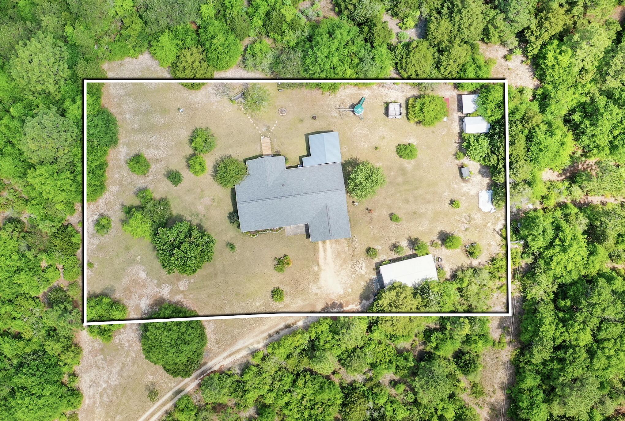 Discover the perfect blend of peaceful country living and everyday convenience in this charming single-family home, tucked away on just over an acre of serene, tree-lined land. Thoughtfully designed with a split-bedroom floor plan, this 3-bedroom, 2-bath residence offers both privacy and functionality. The spacious kitchen and dining area flow seamlessly into a versatile bonus space which is ideal for entertaining or relaxing with family.Step outside to enjoy the best of outdoor living with a large screened-in porch and a separate covered patio, perfect for quiet mornings or hosting friends. The property also features a 30x18 powered garage/workshop and a 15x19 insulated, powered shed with a lean-to offering endless possibilities for hobbies, storage, or small business needs.Located just minutes from schools, grocery stores, restaurants, banks, and the post office, you'll enjoy the tranquility of a country setting without sacrificing convenience. This property is ready to welcome its new owners; come see all it has to offer! 2020 Roof