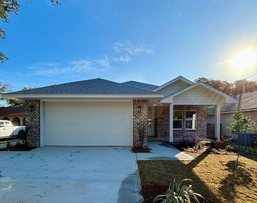 Seller offering to pay up to 4% in buyer closing costs and buy down. Quiet neighborhood, super close to shopping and very convenient to both bases. This 4/3 custom brick home has super curb appeal and is constructed on a large lot with beautiful mature trees. There are 9 Ft. Ceilings w/ impressive crown molding, has plank tile flooring throughout the entire home, and 5 1/4 '' baseboard. As you enter the home through the large covered porch, Bedroom 1 and bath 1 are located at the right of the home. Continuing down the hallway, you pass the huge laundry room on the left and then will enter the gourmet kitchen which boasts painted white cabinetry and stainless appliances (including an oversized commercial grade refrigerator/ freezer). There is a vented range hood above the stove. The microwave is built in to the bottom cabinet at the left of the refrigerator. A large pantry is located at the rear of kitchen for added storage. At the front or the kitchen is the oversized great room that has a floor plug for lamps. Bedrooms 2 and 3, and a "jack and jill" bath are located at the right of the living room. The master suite is at the right rear of the home, is very roomy, has "his and hers" walk - in closets, a custom tiled walk - in shower with a frameless glass enclosure, a whirlpool garden tub with a tiled surround, and a double vanity. Both the master and living room open to a large covered porch, which is perfect for entertaining. The yard is beautifully landscaped, has a privacy fence, and comes complete with a sprinkler system, well, pump and timer. The home has a built in pest control system for the owners convenience. The reversed floor plan is attached.