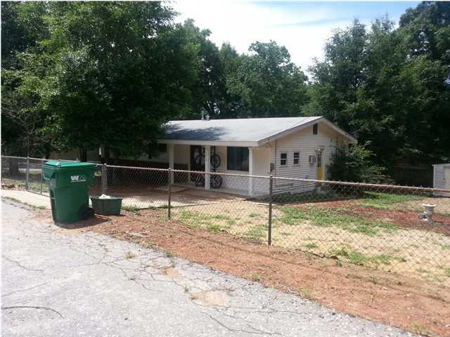 Affordable four bedroom in Niceville. Fully fenced yard with large gates. Large master with shower. Owner has remodeled the kitchen and bathrooms with beautiful tile and cabinets. Kitchen has newer appliances. The Owner currently uses the Large bedroom for a class room. A must see for someone who needs plenty of bedroom space. All this on a large lot with plenty of room for playing or entertaining.