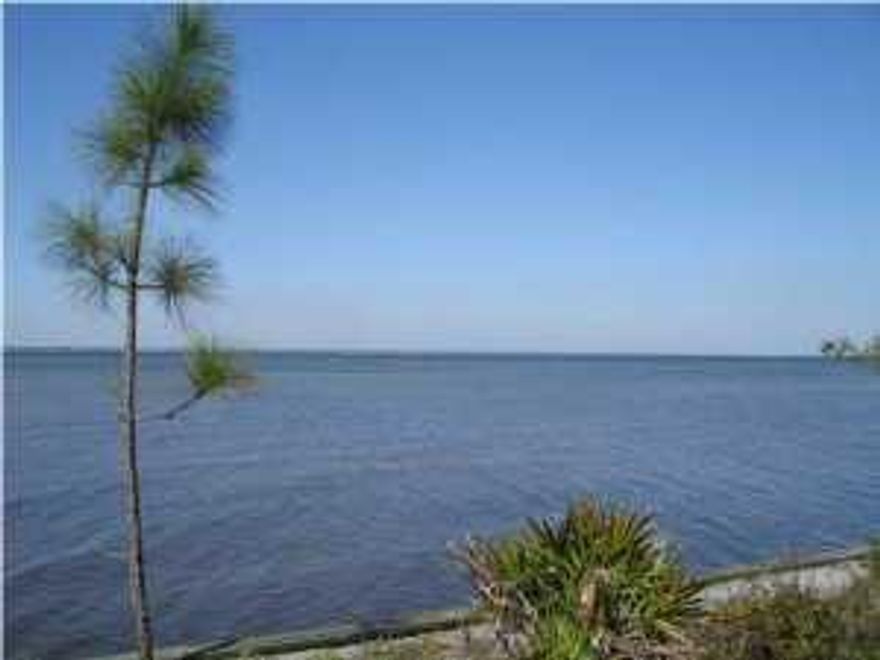 This beautiful Bay Front lot is located in the exclusive gated golf course community of Regatta Bay situated on 120 acres of lakes and natural preserves. Amenities include award winning golf course, club house, tennis court, pool and playground. Just a short walk to the shops , movie theater and restaurants in Destin Commons. The regatta lifestyle is so convenient and centrally located. Take your golf cart to Legendary Marina, Lulus and the new Whole Foods. This is the perfect spot to build your dream home.