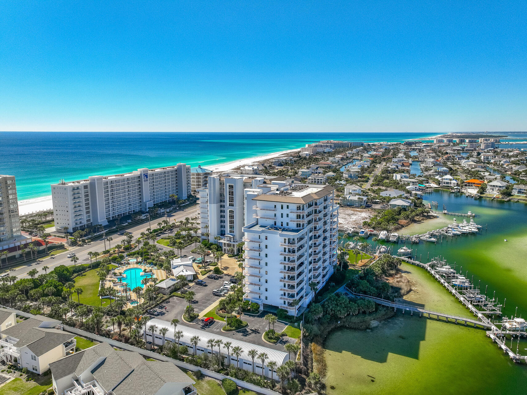 Breathtaking view from this 7th floorSouthwest corner condo on the famous Destin Harbor. The interior of this condo features 8 foot doors, 10 foot ceilings, kitchen granite counter tops, two spacious and private balconies, and outside storage area near entrance door. From this location you have an unobstructed western view of the Gulf, the 9 canals of Holiday Isle, Destin Harbor, distant view of Harbor Walk Village, and even East Pass and Crab Island. Developed by Steve Bennett and built by Roy Anderson Construction, the ground floor of this concrete building is 10 feet above sea level. Generators to power elevators and other emergency equipment is located on the second level. Harbor Landing features deeded beach access right across the street between Oceania and Martinique, hundreds of feet of marina docks and walkways for all owners, boat slips with electricity, water, cable for each slip, gas grills, two heated pools (one is owners only) , fitness room, two hot tubs, children's wade pool, & community room. The assigned parking space is on the second level. Call today and schedule your private viewing of this outstanding condominium. Potential Buyers or their Agents should confirm all information to their satisfaction.