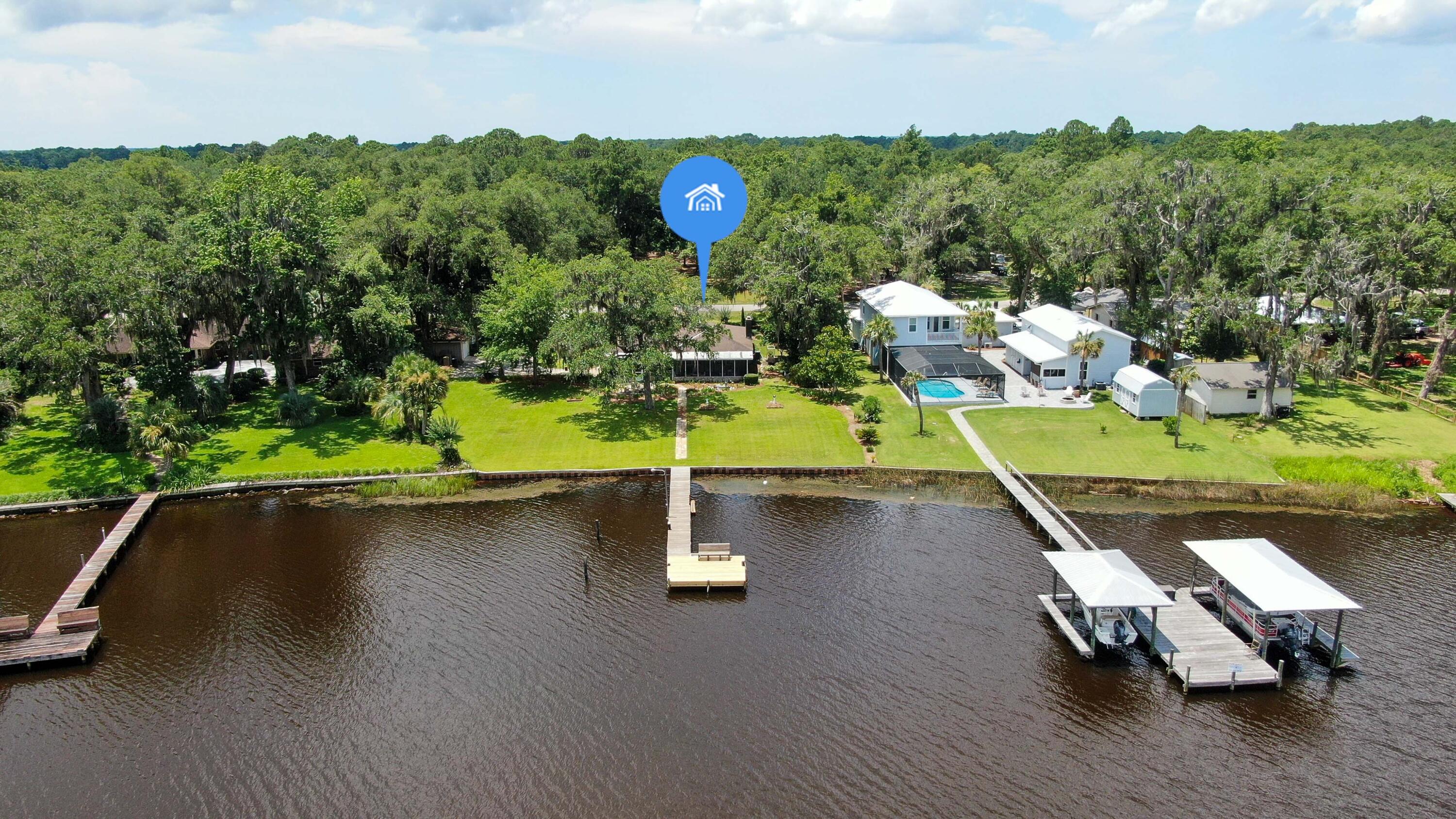 Come check out this JEWEL of a property in the growing city of Freeport, FL. This charming 3bd/ 2 bath brick home sits directly on Mallet Bayou with over 100ft of deep water access with your very own dock. The property is approximately .674 acres; so plenty room to roam with lots of potential; and there is currently a large outbuilding/workshop already with power to house everything from tools to storage. It also features a deep water well and artesian well but city water and sewer is available, if wanted. What are you waiting for? There is no need to miss another sunset on the water. Not to mention you are not far from some of the World's Most Beautiful Beaches and all the action of shopping, dining, and entertainment that Southern Walton County provides. Come call this home yours today!