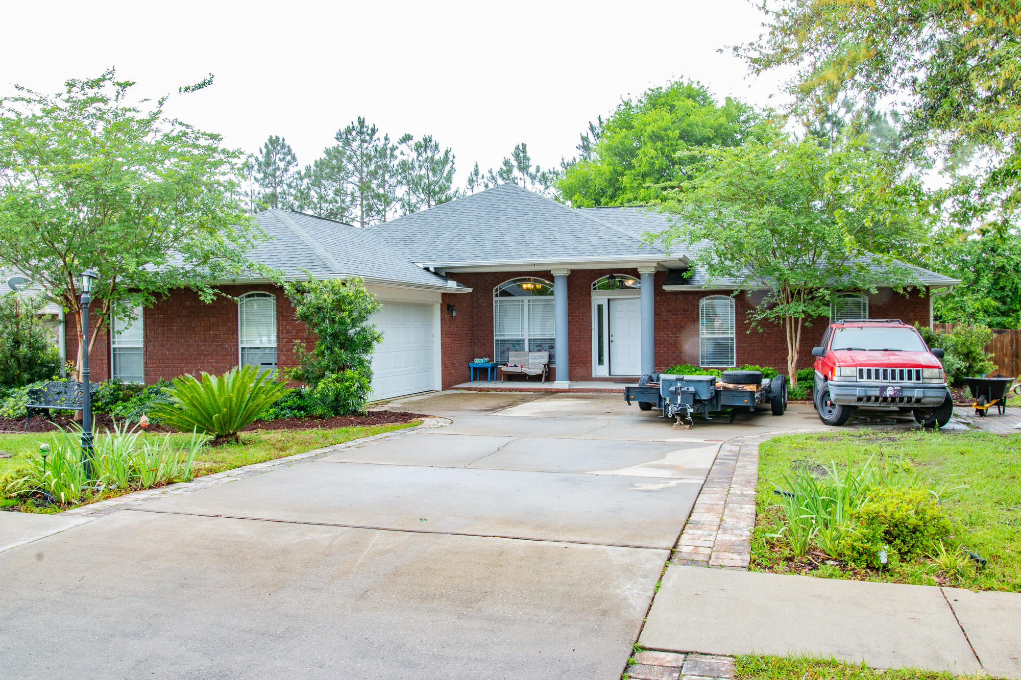 This 4 bedroom/2 bath floor plan easily accommodates generous sized furniture and features both an eat-in kitchen area and formal dining space. This open floor plan has the formal dining on your left and the 4th bedroom/office area on the right and the large living area is straight ahead complete with electric fireplace. The eat in kitchen offers a lovely view of the backyard along with loads of cabinets,soft close drawers, granite countertops, and stainless appliances. The two guest bedrooms and bath are on the right side of the home. Master suite is on the left hand side of the home. The backyard is its own oasis and boasts outdoor media wiring, pergola, extended concrete patio, privacy fenced yard, garden space, lush landscaping, pavers lining all shrubbery, and playground area.