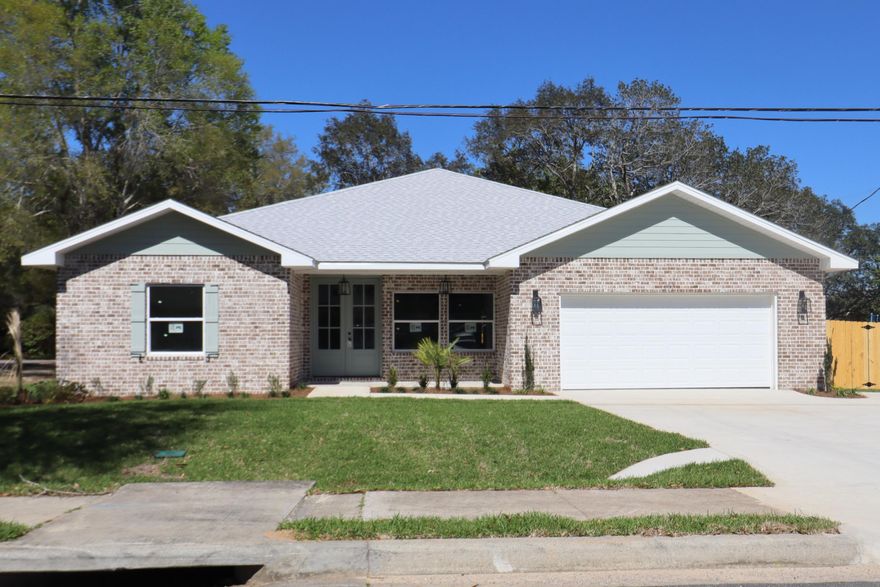 Awesome new plan! This 4/3 custom brick home has super curb appeal. There are 2 master suites with his and hers walk in closets. There are 9Ft. Ceilings w/ impressive crown molding, will have LVP flooring throughout most of the home except for the wet areas which are tiled. At the front of the dining room is the gourmet kitchen which boasts bisque cabinetry, granite countertops, a breakfast bar and stainless appliances including a full-size refrigerator and freezer. The great room is located at the front of the kitchen and opens to a large covered porch which is perfect for entertaining. Bedrooms 1 and 2 are located near the front entry along with bathroom 1. The large master suites are located at the rear of the home and have double vanities, whirlpool tubs and separate showers. Yard will be fully sodded/ landscaped and comes complete with a well and sprinkler system. Completion expected in April 2023.