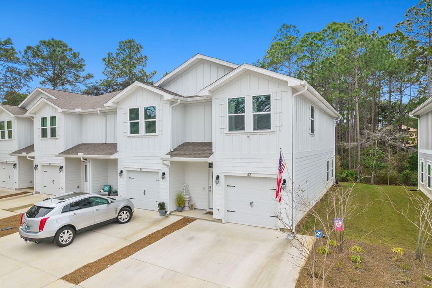 Welcome home to this meticulously maintained end unit townhome in Sandhill Pines! This beautifully furnished home has been a full time residence for the owners since its completion. Upgraded lighting greets you in the entryway and leads you to an open kitchen featuring granite countertops, stainless steel appliances, and a water filtration system. The open floor plan in combination with the half bath on this level make the ideal space for entertaining guests. The second level features a separated master suite and two other bedrooms with a shared bathroom. All bathrooms present with upgraded fixtures, and an upstairs laundry room lends convenience.  Sandhill Pines offers close proximity to Grand Boulevard, Sacred Heart Hospital, and is just a short drive to the beaches of South Walton.
