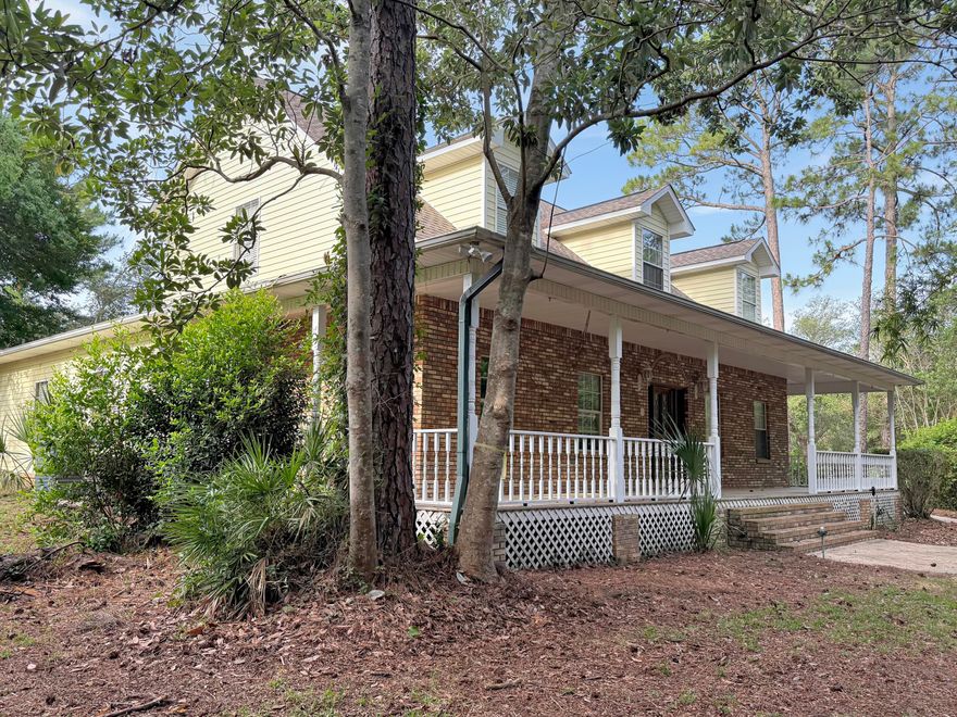 Ready for you to customize your private dream  estate! It's nestled in the beautiful Bluewater Bay area, and guess what? There are no HOA fees! Imagine lush trees, beautifully landscaped grounds, and a soothing stream surrounding this stunning brick home. It has a wrap-around front porch perfect for that southern rocking chairs, and you can relax in the meditation garden with a dock and the soothing sounds of nature. There's a screened-in back porch, a beautiful pool, a spa with a heater, a gazebo, an outdoor shed with two work/storage/hobby rooms, and plenty of space to park a boat or RV. Inside, the first floor features a spacious kitchen with an island and breakfast area overlooking the pool, two family rooms, a large dining room, a primary suite with Huge walk-in closet and a large laundry/mud room with cabinets, a half bath, and an exterior door. The grand staircase in the foyer leads you upstairs to three large bedrooms. Don't miss out on this incredible opportunity! Book your personal viewing today!