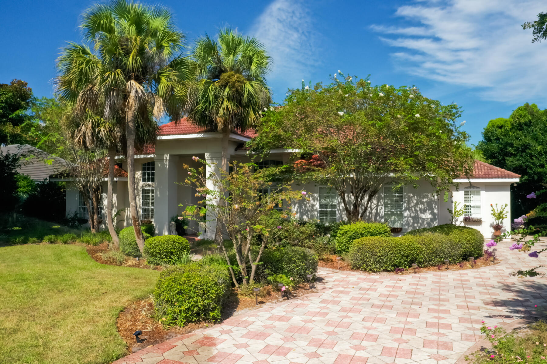Situated within the gated community of Regatta Bay, this spacious lakeside property provides a wonderful layout, ideal for primary living as well as for those looking for a secondary home in one of Destin's most desirable neighborhoods. The interior of the home showcases a blend of tile and hardwood flooring in the living spaces, while additional features such as a formal dining room, home office, and open floor plan offer the perfect mix of traditional styling with modern day conveniences. Vaulted ceilings, a two-car plus golf cart garage, and a freshly painted interior creates a desirable coastal atmosphere within the property.