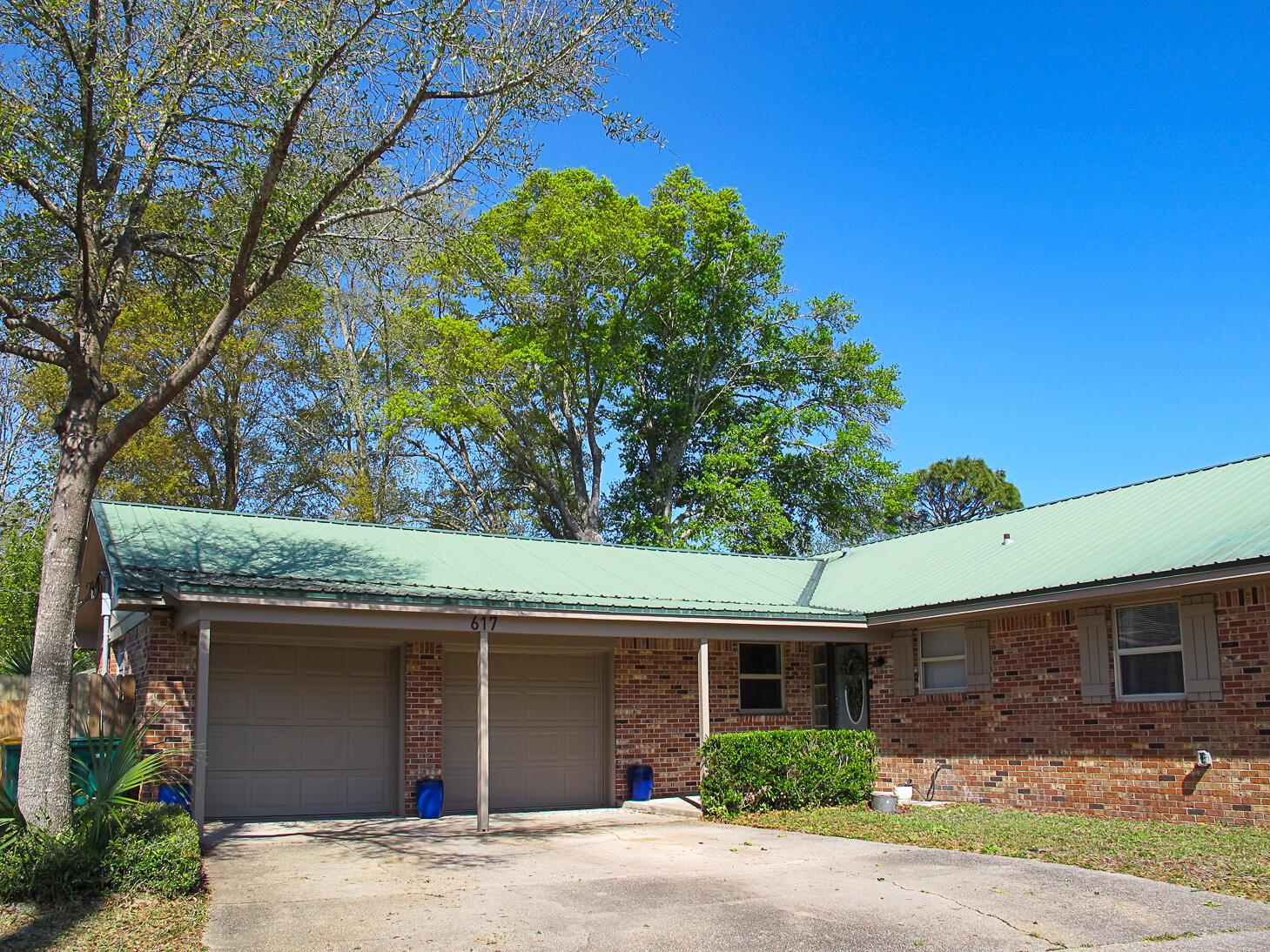 PRICE IMPROVED! This spacious updated 3-bedroom 2-bath home is perfectly located for easy access to beaches and bases, and lives large for its 1698 square feet. Sitting high on a corner lot, the expansive yards provide plenty of space to entertain or play. Updates include primary bath, brand new electrical wiring and contemporary lighting, newer wood-look LVP flooring everywhere except the hall bath, 2022 refrigerator, a 2020 water heater and 2018 HVAC system.A covered front porch offers space to sit with your morning coffee, and the pretty front door opens to a generous foyer. Immediately to your left is an expansive flex space, currently used as a dining room accommodating a large table... (Keep reading) ... A large closet to the side provides additional pantry and/or storage space. The kitchen features granite counters and a tile backsplash, and lots of storage including a cabinet pantry. Through the kitchen is a bonus room accented with wainscoting that could become a smaller dining room if you prefer the larger flex space as a family room, or would also make an ideal office space. Complete the circle to the comfortable, open living room.
All the bedrooms have ceiling fans. The sunny primary bedroom is good-sized with a smaller walk-in closet. The beautiful primary bath was renovated with contemporary colors, a custom tile shower surround, and a large vanity with a quartz top. The hall bath has been very well maintained, features original tile on all walls, and a newer sink and lighting fixtures. And there are not one, but two linen closets!
Exit the back sliding glass doors off the flex space into an ample screened Florida room, another great space for morning coffee and watching the kids or pets play. The sturdy play set with swings and a slide conveys, as do the washer and dryer.
Schedule your showing today, don't miss this charmer!