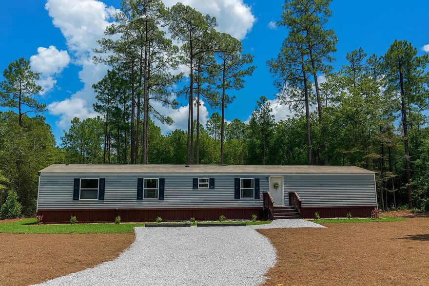 JUST REDUCED!  HURRY! Brand new and never lived in, this Clayton Sunsations 4BR/2BA manufactured home offers stylish living at an unbeatable value. Features include laminate flooring throughout, an open floor plan, and a gorgeous kitchen with a large island, all new appliances (including washer, dryer, and even a big-screen TV!). The private master suite boasts a walk-in closet and full bath. Enjoy energy-efficient construction, a peaceful setting, and evenings by your own outdoor fire pit. Prime location with easy access to schools, shopping, and historic downtown DeFuniak Springs. Move-in ready! Seller is offering a $1,500 buyer furniture credit buyer can use how they choose. Seller will select and pay for owner's title insurance.  Hard to find a 4-bedroom home at this price--call today!