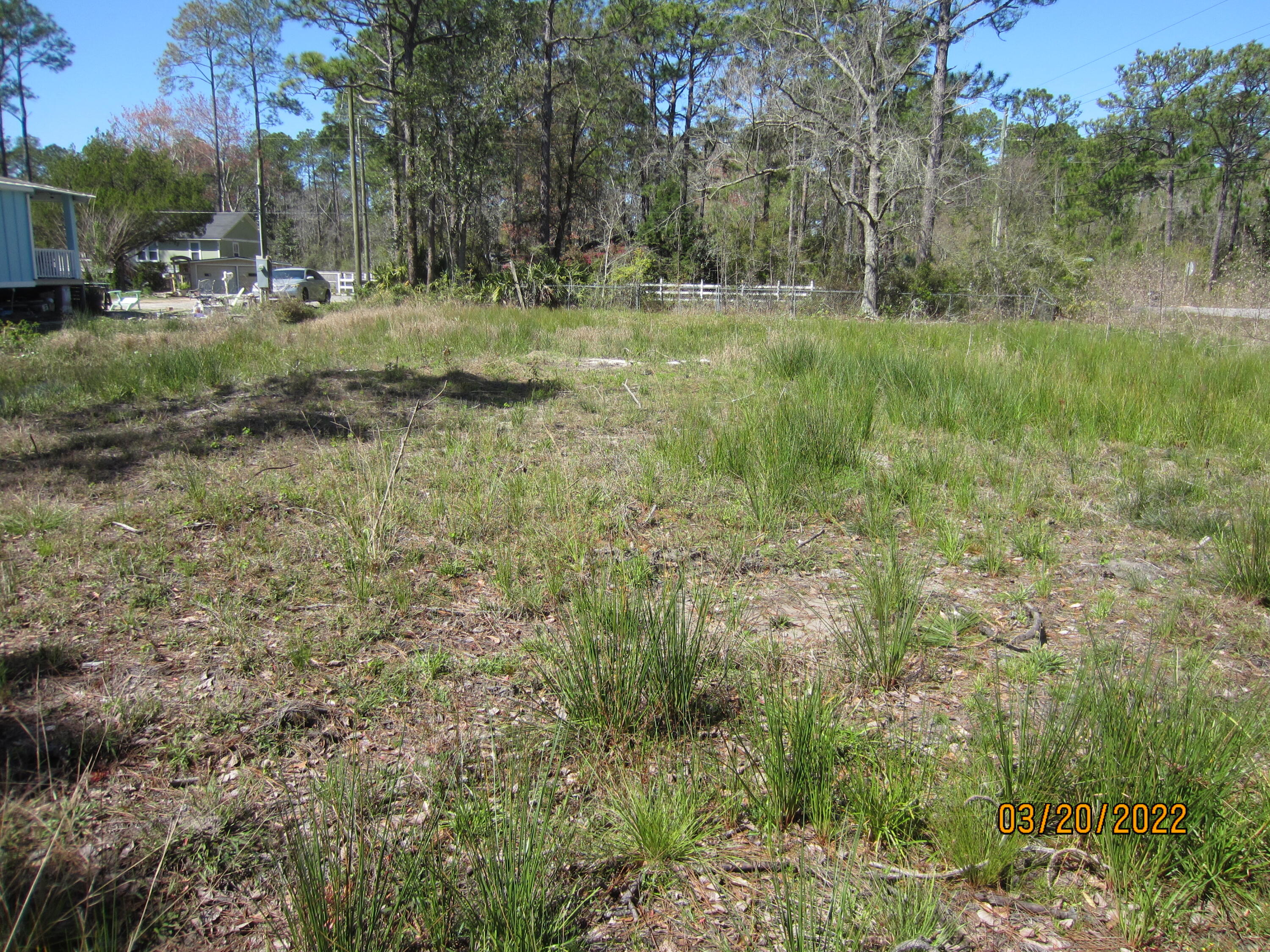 Corner lot on a paved street. Entry to lot from E. Ann St is convenient with culvert in place. Lot is cleared with elevation of 7 feet. Excellent for mobile home, tiny home or build the home of your dreams. No HOA. No monthly fees to pay. Public water and sewer are on the street. Tap fee for both water & sewer hook-up currently approximately $9,500. Convenient to Cessna Landing to launch your boat. Swim and enjoy the beach at Walline Park on South 393. This beach has lifeguards, handicap access, restrooms, and beachside parking. This lot is 50x125. Survey & Elevation Certificate available.