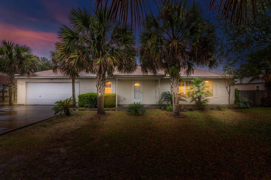 Great Location! Bright, open and airy, this 3/2 checks the boxes. Drive up on the oversized concrete drive, with enough room for boats and RV's. Vaulted ceilings, wood laminate, tile and ceiling fans deliver in the open Living/Dining/Kitchen. Expansive counter space, breakfast bar, glass top range, and a large pantry complete the kitchen. Do dishes in the deep sink while overlooking the massive back yard. Split floor plan Master bedroom features tile floors, ceiling fan, and blinds. A large closet off the master bath and a separate toilet room with tub/shower combo make this a retreat. Two additional carpeted bedrooms also feature ceiling fans and blinds. An additional full bath with large vanity top finishes the interior. Covered deck, 2 car garage and 0.65 of an acre! Roof is DEC 2006