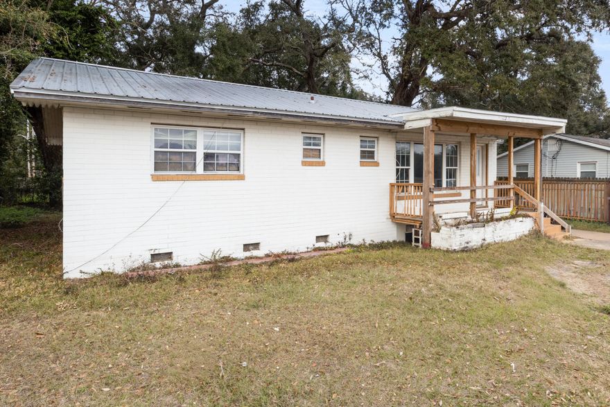 Charming single story ranch on a spacious, irregular lot just minutes from downtown Pensacola. Zoned HDMU, this property offers flexible use potential, including residential and certain commercial or mixed-use opportunities (buyer to verify intended use).This home offers approximately 1,614 total sqft, with 1,420 sqft of heated and cooled living area, a functional floor plan, multiple living spaces, and solid mid-century construction. Interior highlights include original hardwood flooring, ample natural light, and generous room sizes throughout.Property will require moderate TLC due to prior tenant wear and tear, making it an excellent opportunity for investors, renovators, or owner-occupants looking to add value. Large lot provides additional flexibility for parking,