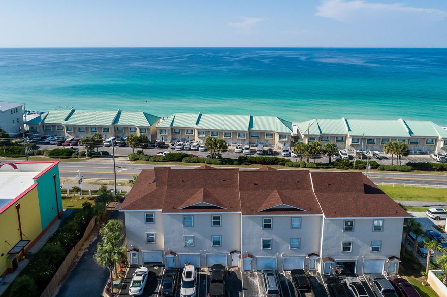 Looking for a large, updated unit, just steps to the beach with Gulf views and a garage? Residences at Royal Seaesta don't become available often! Perfect as a primary residence, second home or investment property with excellent income potential, with three floors of living space and situated directly across the street from the Gulf. Offering two master bedrooms and two additional bedrooms, each with their own baths. Just renovated with new granite counters and new luxury plank vinyl in two bedrooms, freshly painted. The second master is first level, with separate entrance providing flexibility and could be rented out separately. Additional features include 9 foot ceilings, tiled floors, and garage.