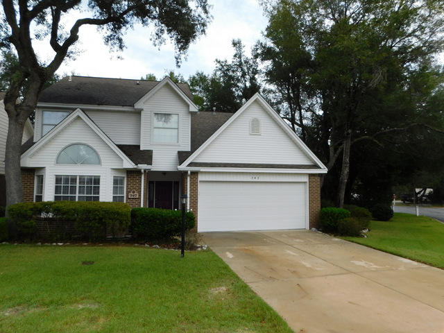 Centrally located in the heart of Beautiful Bluewater Bay, this home is a 3 bedroom and could be easily converted to a 4 bedroom home, just as others have been done in this same floor plan. There are 2 and a half bathrooms and a dining area along with a breakfast nook. The kitchen is quite large and offers ample storage with solid surface counter tops and extensive cabinetry, tiled floors and a eat-in breakfast nook. The master bedroom is on the first floor, and there are vaulted ceilings along with a sitting area. Outside, you will find a nicely landscaped property with an open deck and an enclosed sunny Florida room. There is also a termite bond in place for that extra piece of mind. Situated on a nice corner lot, the seller is even offering the new owners a one year home warranty.