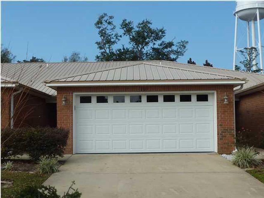 CLASSY, ONE-STORY TOWNHOME. ALL BRICK WITH METAL ROOF. UPGRADES THROUGHOUT. WOOD LAMINATE AND CERAMIC TILE FLOORS. DESIGNER PAINT. SPACIOUS LIVING ROOM WITH TRAY CEILING. KITCHEN FEATURES CORIAN COUNTERS, GLASS TOP STOVE, BUILT IN MICROWAVE, REFRIGERATOR WITH ICE MAKER, AND A BREAKFAST BAR. BATHS ARE ALL MARBLE, WITH A SOAKING TUB IN THE MASTER. CEILING FANS. 2-CAR GARAGE. CONVENIENTLY LOCATED NEAR SHOPPING, AIR FORCE BASE, SCHOOLS AND BEACHES.