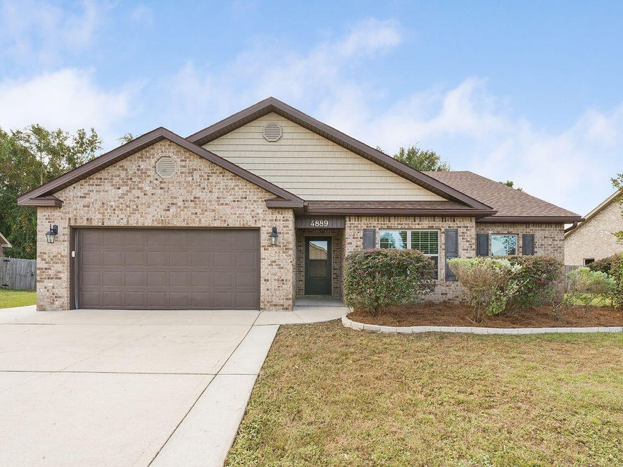 Welcome to this beautifully maintained 4-bedroom, 2-bath all-brick home offering 1,976 square feet of comfortable, thoughtfully designed living space in a convenient Pace location.Inside, you'll find fresh interior paint and brand-new carpet in all bedrooms, creating a bright and inviting atmosphere. The open-concept kitchen flows seamlessly into the living area, making the home ideal for both easy everyday living and effortless entertaining.A new roof installed in 2021, paired with the long-lasting durability of an all-brick exterior, provides excellent peace of mind. The fenced backyard offers a private outdoor escape with plenty of room to relax, host gatherings, or let pets enjoy the space -- complete with an existing playset for added convenience. Situated on a spacious lot within a small HOA community, this home offers the perfect balance of privacy and accessibility. You're just minutes from Publix, Target, dining, shopping, and highly rated local schools. A two-car garage and a series of thoughtful updates make the home move-in ready from day one.

With its solid construction, larger lot, and welcoming neighborhood atmosphere, this property delivers exceptional value and everyday comfort in a prime Pace location.
