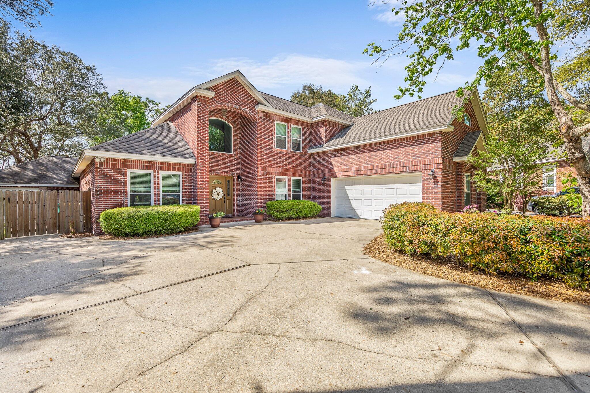 Showings to begin Thursday 4/14 with an Open House Saturday 4/16 10AM-1PMThis lovely brick home has been meticulously cared for with no detail missed. Fresh paint and carpet were just installed making your new home move-in ready! Beautiful kitchen has a Viking gas cooktop, double wall oven and brand new countertops. Living room has a vaulted ceiling and is accented with a custom slate fireplace. Main floor master suite has tray ceiling, double vanity, bath with Jacuzzi tub and separate shower. A formal dining room, office and additional bedroom with ensuite bath finish off the first floor. The second floor has two more bedrooms, full bath and spacious bonus room. Step outside to enjoy the covered patio, enclosed pool area and detached 400 sq ft pool house/mother-in-law suite