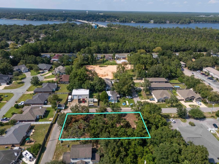 Attention builders, investors, or buyers dreaming of creating your own sanctuary. This is the first time this vacant lot has been offered for sale. It's hard to find a residential lot that is almost a half-acre and is ideally situated near the Mid Bay Bridge connector leading you to Destin within a matter of a few minutes. Be sure to take advantage of this corner property before it's too late. The property has been recently cleared, leaving behind mature trees, and won't take too much to start building on and providing the perfect opportunity to bring this property to life whether it is for profit or homesteading. A new survey will be available soon. The road is county maintained, and the zoning is identified as ''Mixed Use'' allowing for single-family houses or