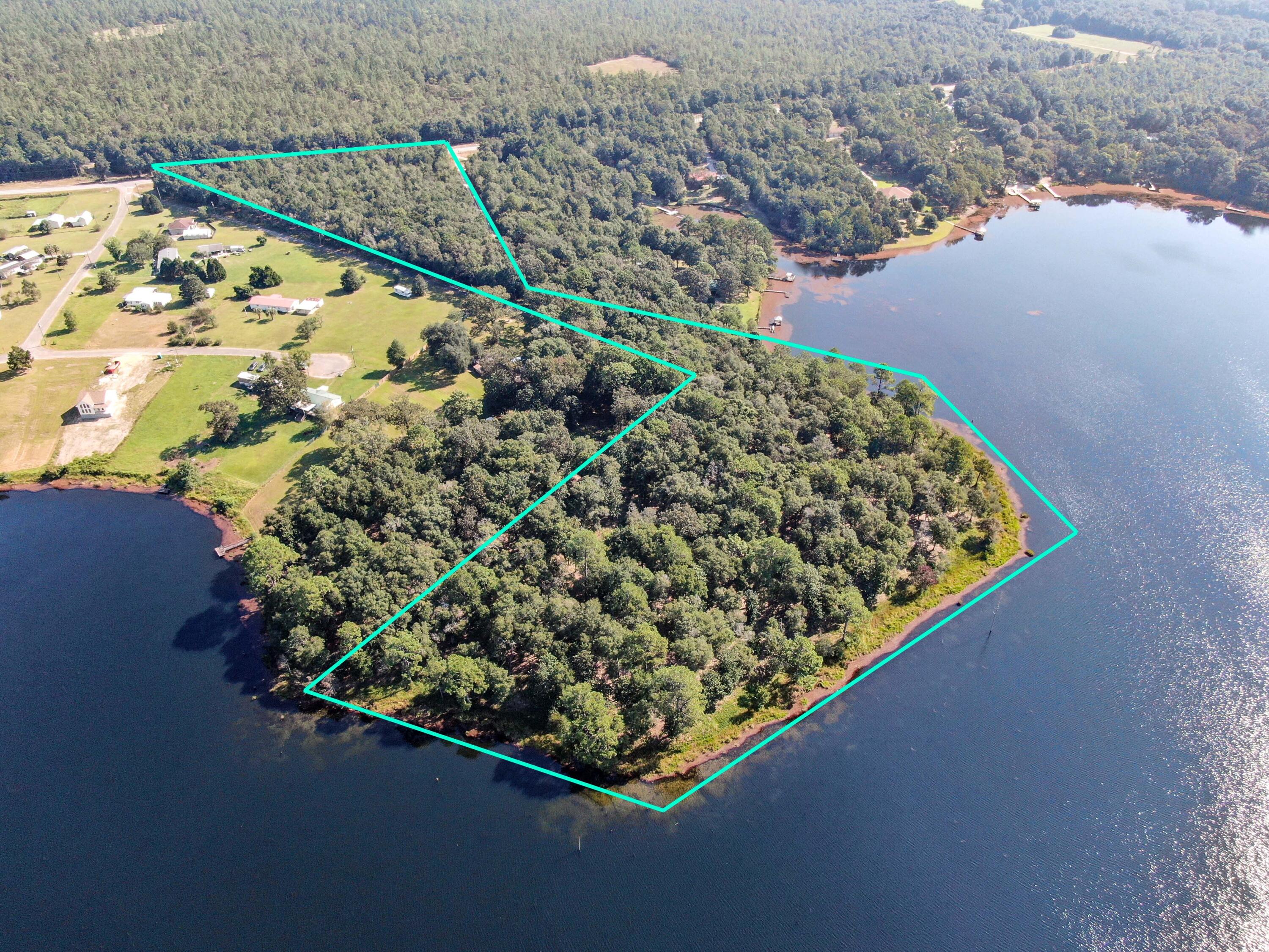 ONE OF A KIND! this is the last big parcel left for sale on King Lake. 13.7 acres. 630 feet on highway 331. 1400 feet of waterfront on King Lake, a 450 acre +- trophy bass & bream fishing lake. This parcel could be your dream come true home site or a smart land investment. Zoning is Rural Village with a maximum density of 2 units per acre. Rural Village zoning when a parcel is 5 acres in size or larger allows for RV Park, general store, fish camp, bait & tackle shop, riding or boarding stables, veterinary services and kennels.