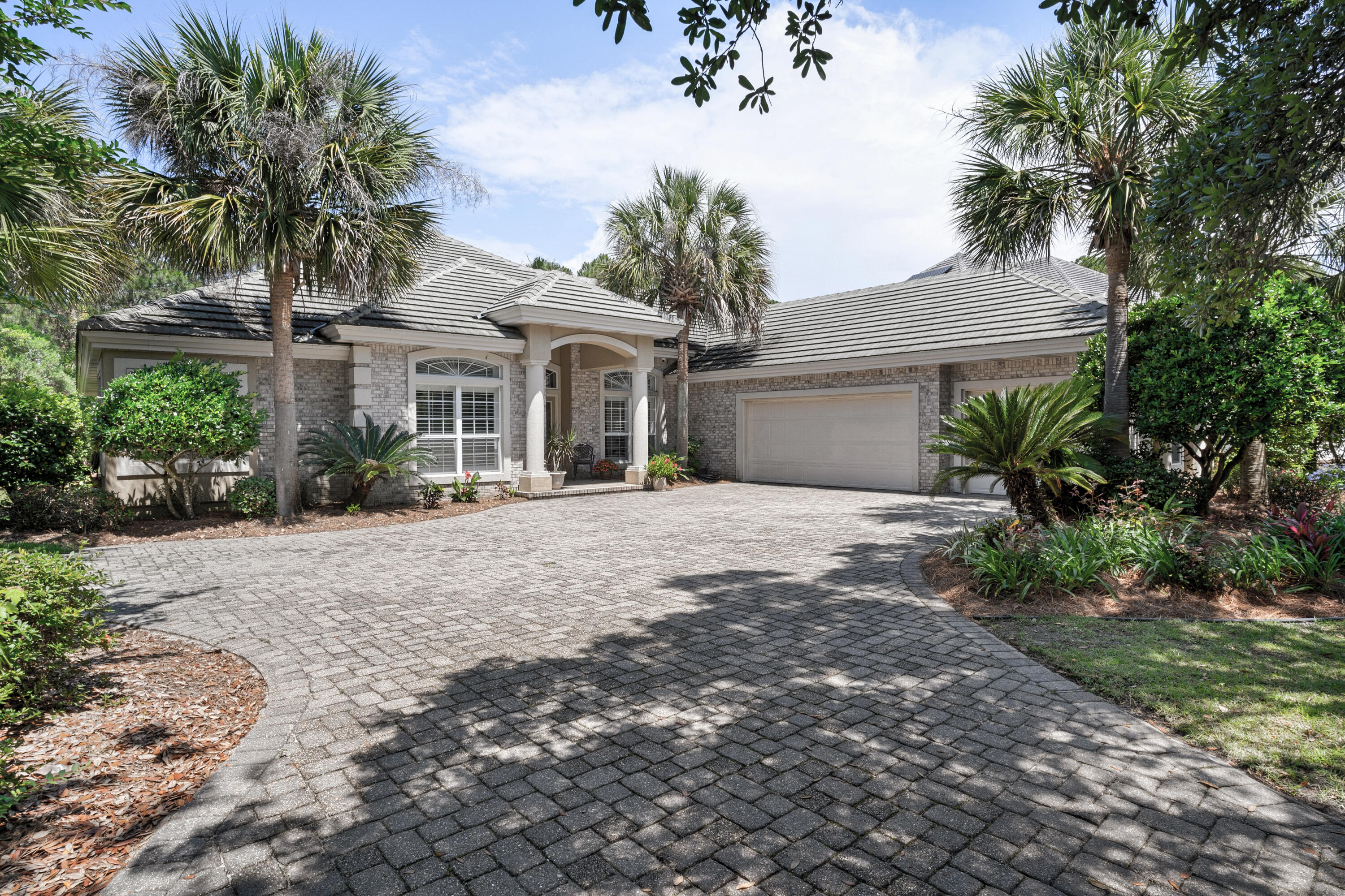 This 1-story 4b/3b custom home is located within Destin's renowned Regatta Bay Golf & Yacht Club. Choose this home if you value quiet comfort away from Destin traffic noise. Mature oaks, lush landscape, 3-car garage, cobblestone pavers, and generous backyard accentuates the exterior. The interior's open plan offers an entrance foyer, dining-living combo area, high ceilings, and hardwood floors. To the left of entrance are two fully private bed/bath suites. To the right of the entrance and down the hall are two additional bedrooms with a shared full bath. Toward the back is a second open area with kitchen, chef's desk, breakfast bar, breakfast nook, den with fireplace, and patio. View the attached photos to see the floor plan and learn more about the many features and amenities.