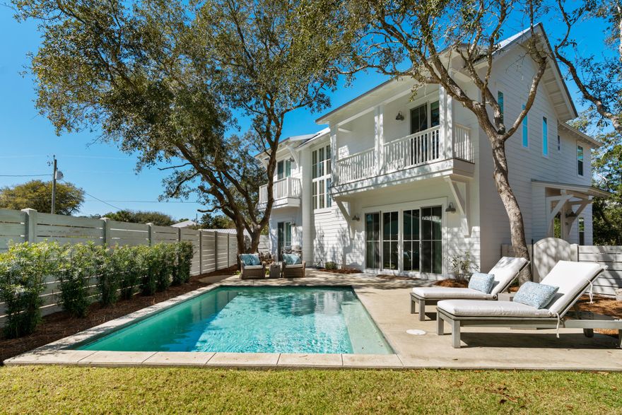 South of 30a and just one block to the beach! Amazing opportunity to own this custom crafted & professionally decorated 4 bedroom, 4 bath coastal oasis that is located in the heart of Blue Mountain Beach. This beach home exudes coastal elegance and a thoughtful simplicity while blending seamlessly with the natural vegetation and scrub oaks that abound on the property. Features are numerous and include an open concept layout, 10' white oak floors, limestone countertops, custom cabinetry, large kitchen island, farmhouse sink, stainless steel appliances, transom windows, raised & cathedral beamed ceilings, Euro sliding doors, spacious bedrooms with en suite baths and a heated salt water pool that is nestled in a large, fenced in back yard. This lovely home embodies 30a living at its finest!