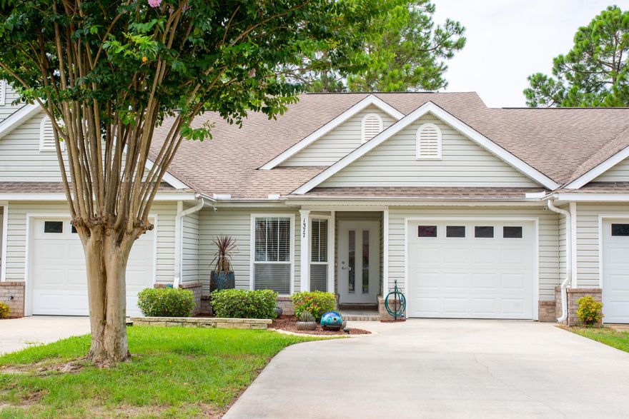 Just what you've been waiting for, this 3 Bed 2 and a half bath townhome is conveniently located in the highly sought after Tiger Lake subdivision! This is a great location nearby to restaurants, retail, community lake, and easy access to the beach! The Tiger Point Recreation Center is practically in your back yard. Step out back to the walking track for your daily exercise. This facility includes tennis courts, soccer fields, a walking track, picnic and gazebo area, and a playground. Hoa also provides a termite bond and lawn maintenance. This home features an open floor plan and flows beautifully. The master bedroom suite is on the first floor including master bathroom with marble vanity and enormous walk-in closet, split bedroom layout, and high vaulted ceilings.The great room has vaulte