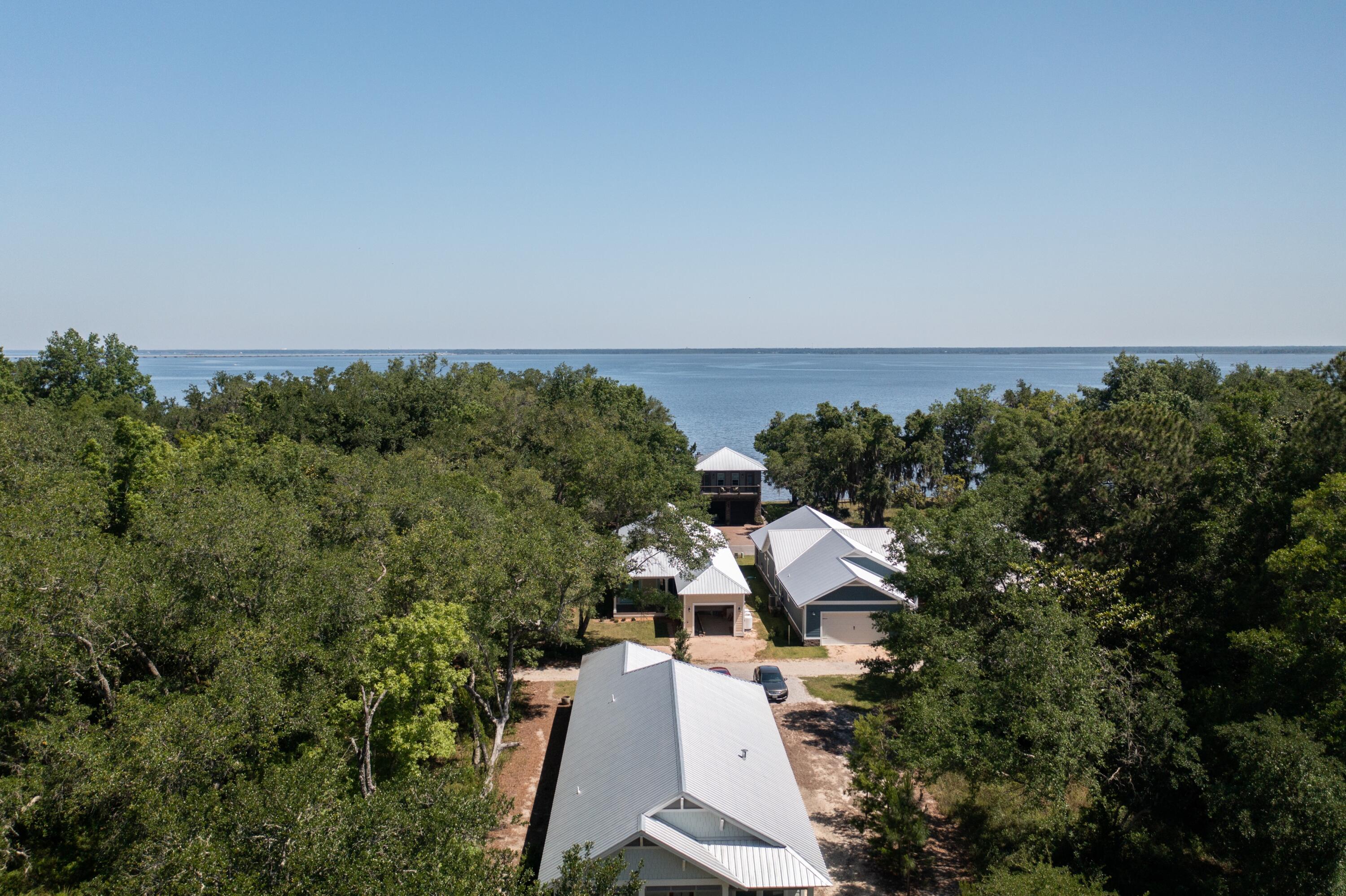 Tired of trying to find your perfect house? Just build it on this beautiful cul-de-sac lot in Grayton Bayou! Surrounded by Magnolias and Oaks, this Flood Zone X lot with Private Drive is situated a block away from the neighborhood's private pool and jacuzzi. There is also a public dock with boat launch and Bayfront park - perfect for a picnic or to put in a kayak/SUP. Potential for Bay views, depending on the build, but whatever you choose to put here is up to you! Don't miss out on the popular Point Washington, an historic South Walton place to live.