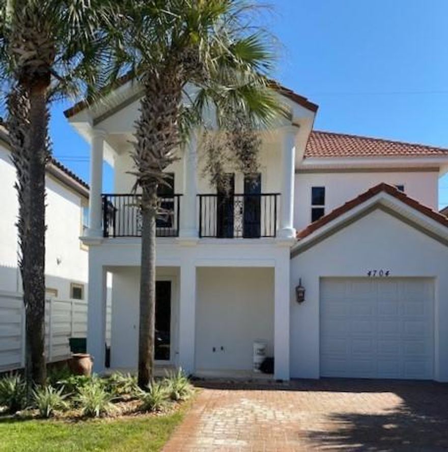 Tucked away off the beaten path in the small, gated community of Calusa Bay is this three-bedroom, two-and-a-half-bath home with more than 1,900 square feet of living space. The interior of the home has thoughtful finishes such as granite counter tops, stainless steel appliances and tile back splash in the kitchen; tile flooring throughout the first floor with hardwood on the second and a fenced backyard with paver patio. The second-floor master suite includes a soaking tub and custom closet with French doors that lead to a private balcony. The exterior of the home is stucco with a slate tile roof, accessible via a brick paver driveway. A washer and dryer convey with purchase. Calusa Bay is a quiet residential neighborhood with low HOA fees, a community pool and close access to the beach.