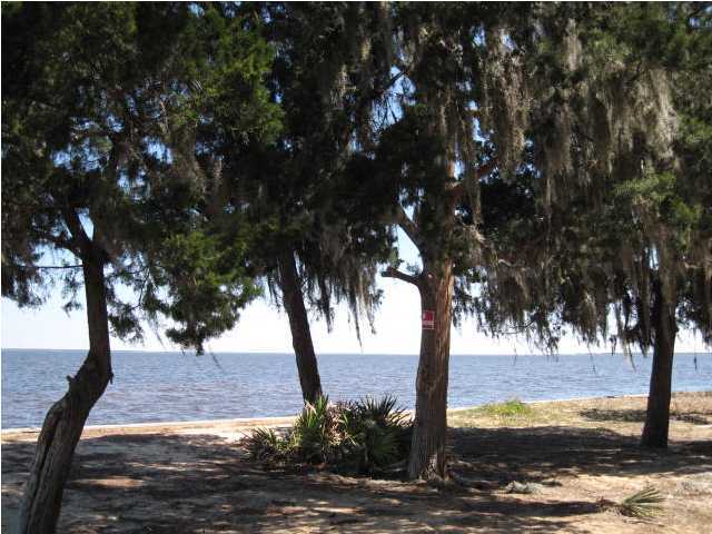 Rare find!!! Heavily wooded bay front lot on small, secluded cul-de-sac. Seller states there are sunrise and sunset water views from this lot!!! Large trees with picturesque Spanish moss. This is the ONLY CUL-DE-SAC WITH BAY FRONT LOTS in Driftwood Estates. There is a path to walk this lot at end of cul-de-sac to see the expansive views of the bay it offers!!! Click on MLS Parcel ID Number to view map depicting unique location in subdivision of this lot.