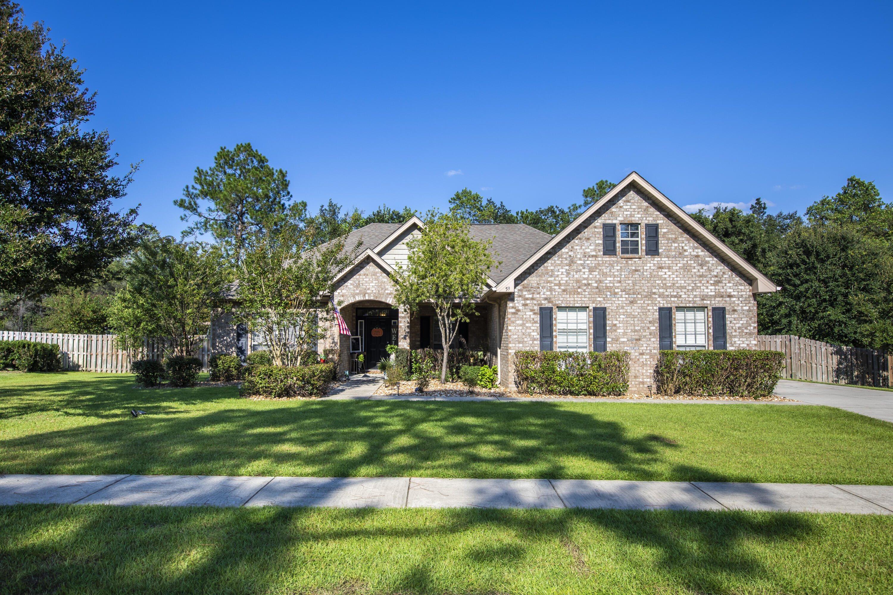 REDUCED!!! MOTIVATED SELLER!!! This beautiful home in the much desired Sounds subdivision in Hammock Bay sits on a half acre lot and backs up to preserve property! With 4 bedrooms plus a media/office room and 2.5 baths, this 2700+square foot home gives you plenty of space for your family! Some features in this beautiful home include water resistant LVP flooring, gas hot water heater, custom wood burning fireplace in the living room (that heats the entire house!), large bedrooms, large firewood lean-to on the side of the home, AC in the garage, large attic space above garage for storage, hurricane shutters, vaulted ceiling in the living room, and a tray ceiling (with crown inside the tray) in the Master Bedroom. Walking outside the back door, you'll see the very spacious back deck