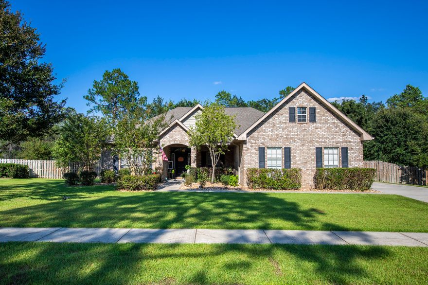 REDUCED!!! MOTIVATED SELLER!!! This beautiful home in the much desired Sounds subdivision in Hammock Bay sits on a half acre lot and backs up to preserve property! With 4 bedrooms plus a media/office room and 2.5 baths, this 2700+square foot home gives you plenty of space for your family! Some features in this beautiful home include water resistant LVP flooring, gas hot water heater, custom wood burning fireplace in the living room (that heats the entire house!), large bedrooms, large firewood lean-to on the side of the home, AC in the garage, large attic space above garage for storage, hurricane shutters, vaulted ceiling in the living room, and a tray ceiling (with crown inside the tray) in the Master Bedroom. Walking outside the back door, you'll see the very spacious back deck