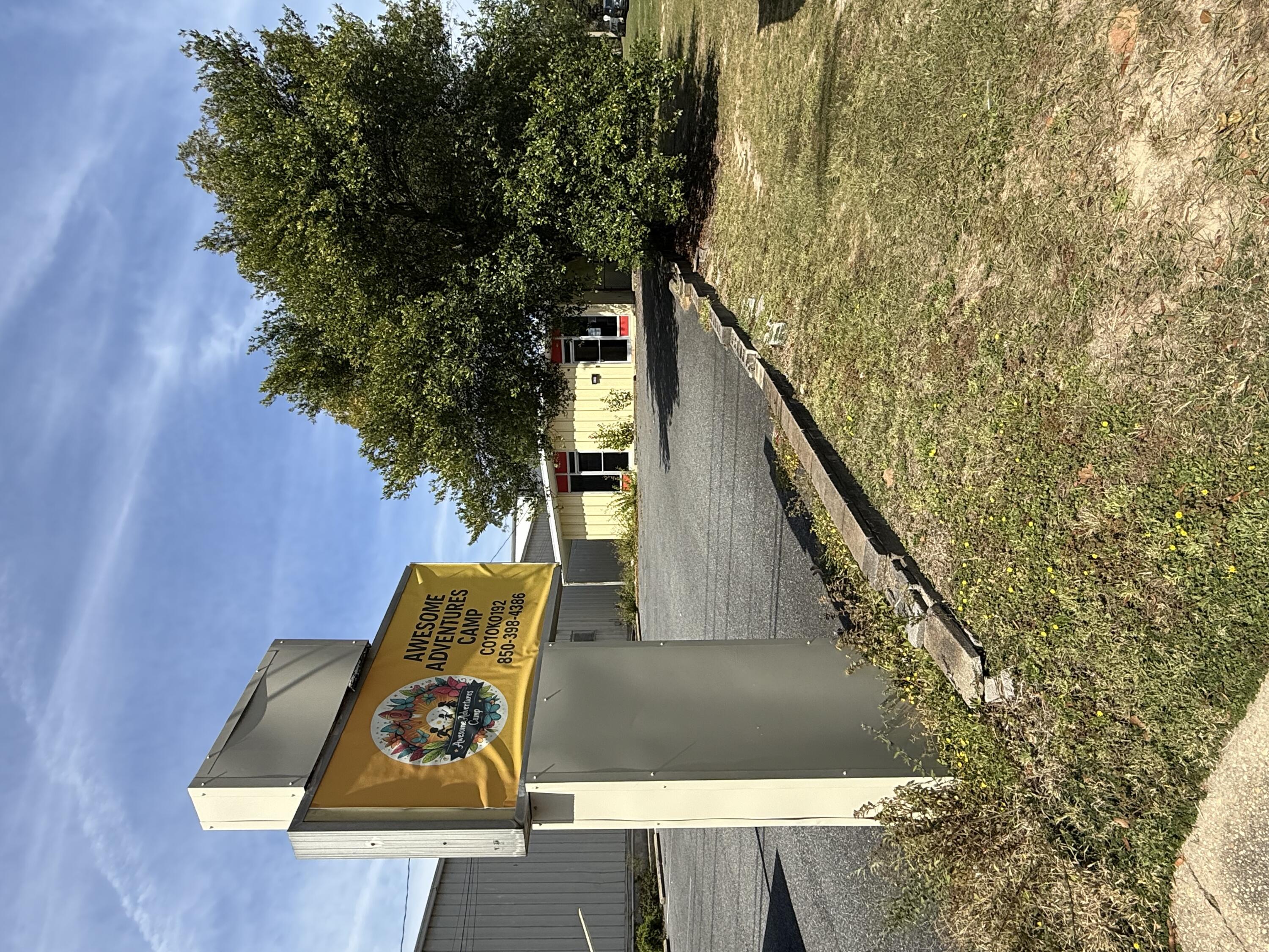 Amazing opportunity to rent a building and huge lot near the busy intersection of 90 and 85. Tons of exposure with Hwy 90 frontage and marquee. Currently configured as a daycare, the opportunities are endless. Includes large fenced lot behind unit. NO CAM!!! Call to see today!