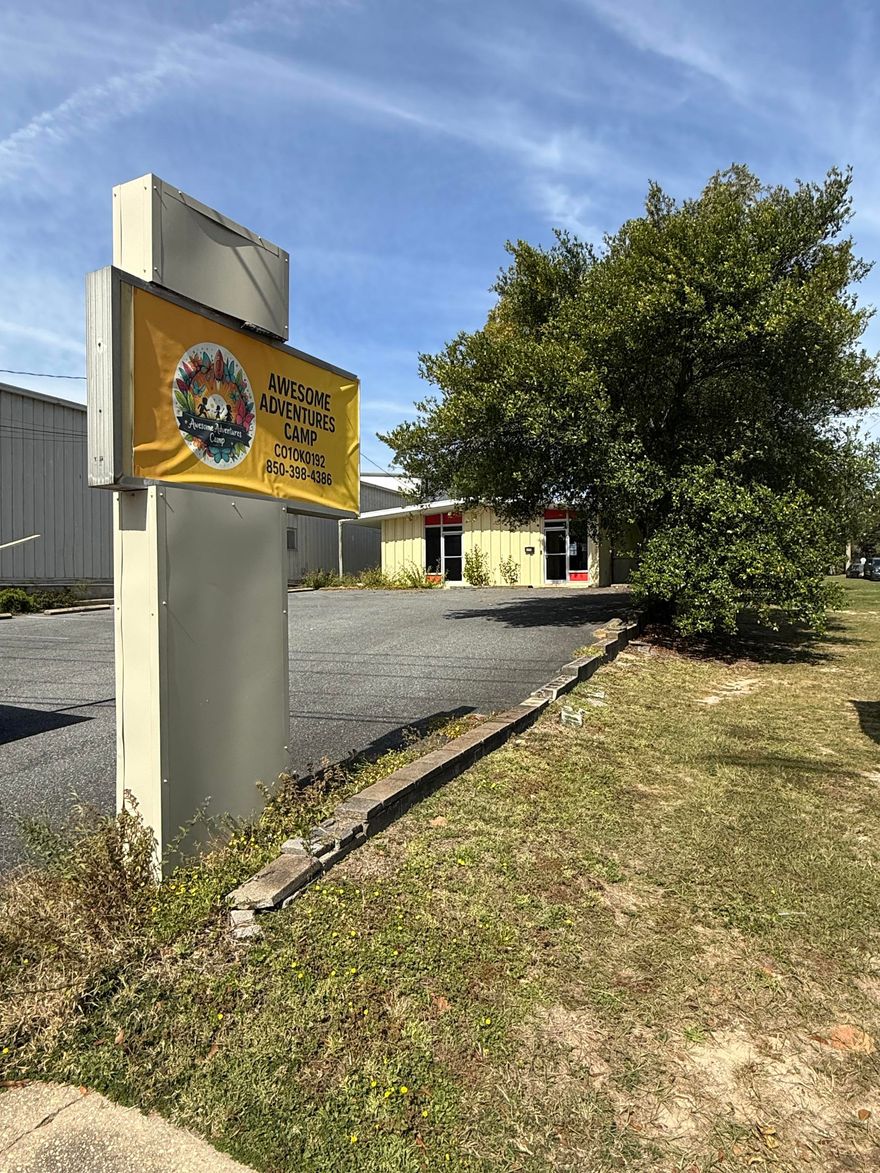 Amazing opportunity to rent a building and huge lot near the busy intersection of 90 and 85. Tons of exposure with Hwy 90 frontage and marquee. Currently configured as a daycare, the opportunities are endless. Includes large fenced lot behind unit. NO CAM!!! Call to see today!