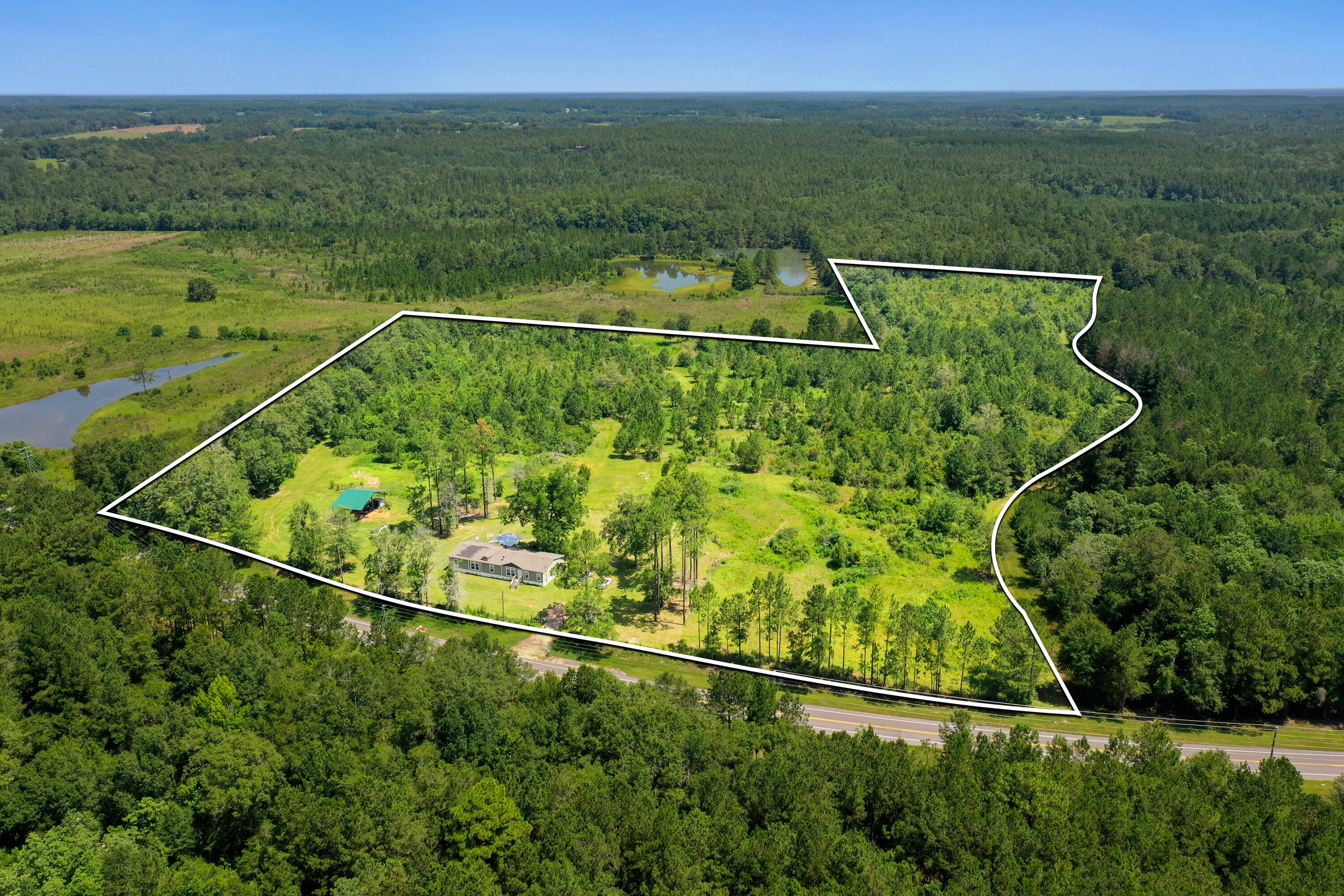 Just under 20 acres of beautiful Florida land. Partially cleared and with a manufactured home built in 2020 this land offers comfort, convenience, and a canvas to enjoy everything that it has to offer.
