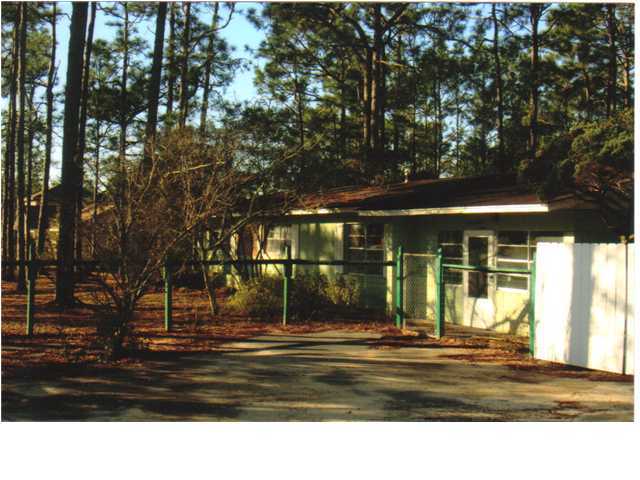 This large block home is situated on the corner of Bourbon Street and HWY 331. The 3 bedroom home fronts on HWY 331 and is on one lot, giving someone the ability to use the other 3 lots for building or use them for a large fenced yard. The home will need some updating and is sold ''AS IS.'' This is a prime parcel with 4 lots fronting on HWY 331 and the entrance to Cross Creek Estates. A new paved and lighted road has just been completed and a turnlane was put into the road. Great large parcel with many possibilities.