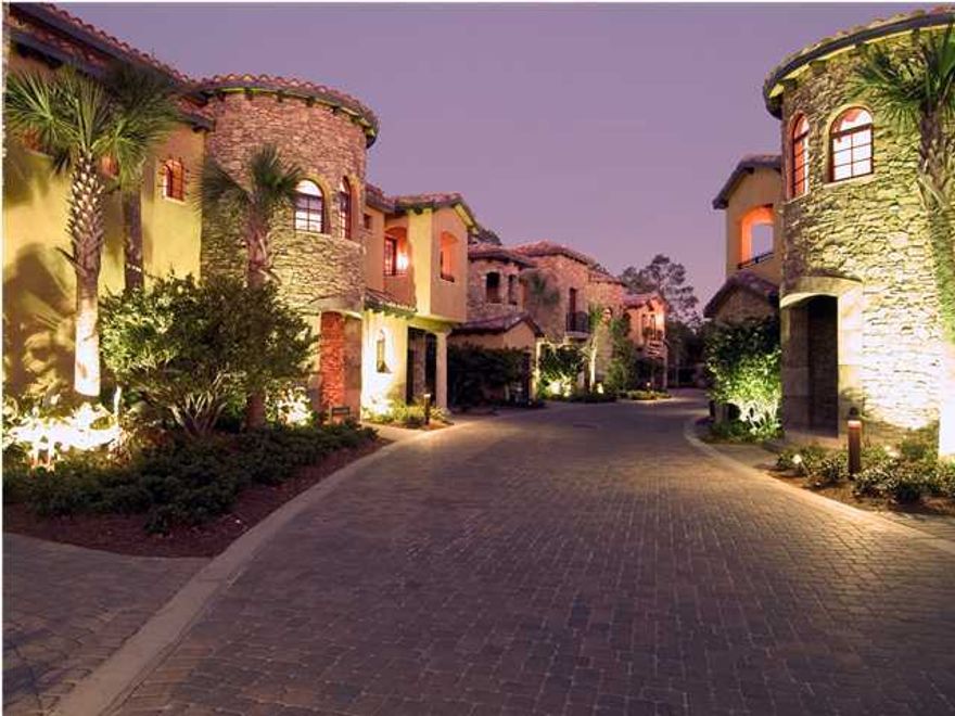 This Tuscan themed townhome is sure to impress with its Italian design and charming interior featuring tile roofs, turrets, stone work, washed stucco, exposed rafters and beams. Other features include Viking appliances, granite countertops, stone fireplace, travertine floors, custom woodwork, private courtyard with outdoor kitchen, and beautiful wine cellar. Truly a must see home. Come see what all a Resort Community has to offer. Amenities available with the lease of this home (for a one-time, $150 administrative fee per lease term) are daily kayak, bike and boogie board rentals, daily tennis court time, fitness club access (with spa and steam rooms), access to the resorts four pools, and discounts on golf and beach set-ups.