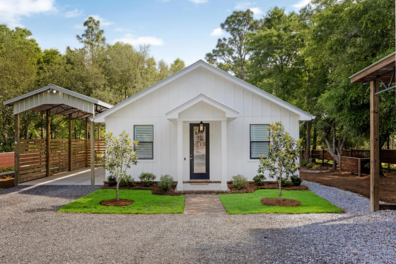 Charming Lakefront Florida Cottage - 2 Bed, 2 Bath with Modern Upgrades and Outdoor LivingEscape to tranquility in this meticulously designed and beautifully appointed 2-bedroom, 2-bath Florida cottage nestled on a serene lakefront lot. Perfect as a full-time residence, weekend retreat, or income-producing vacation rental, this home seamlessly blends modern comfort with timeless charm.Inside, you'll find an open-concept living space featuring durable and stylish LVP flooring, elegant quartz countertops, a classic farmhouse sink, and a full suite of stainless steel appliances, including a propane stove and cooktop ideal for culinary enthusiasts. Both bathrooms are appointed with custom tile finishes, offering a spa-like feel. Step outside onto your low-maintenance Trex deck porch, the perfect place to relax and soak in lake views. Enjoy direct water access from your private Trex deck dock, ideal for fishing, kayaking, or simply unwinding by the water.
With two RV hookups and a robust 400-amp electrical service, this property is thoughtfully equipped for guests, expansion, or future additions. No expense was spared and no detail overlooked in this privacy laden property with minimum maintenance in mind.
Don't miss this rare opportunity to own a turnkey lakefront getaway with all the modern upgrades and Florida charm you've been looking and only a 45 minute drive to the white sand beaches of the Emerald Coast in south Walton county.
