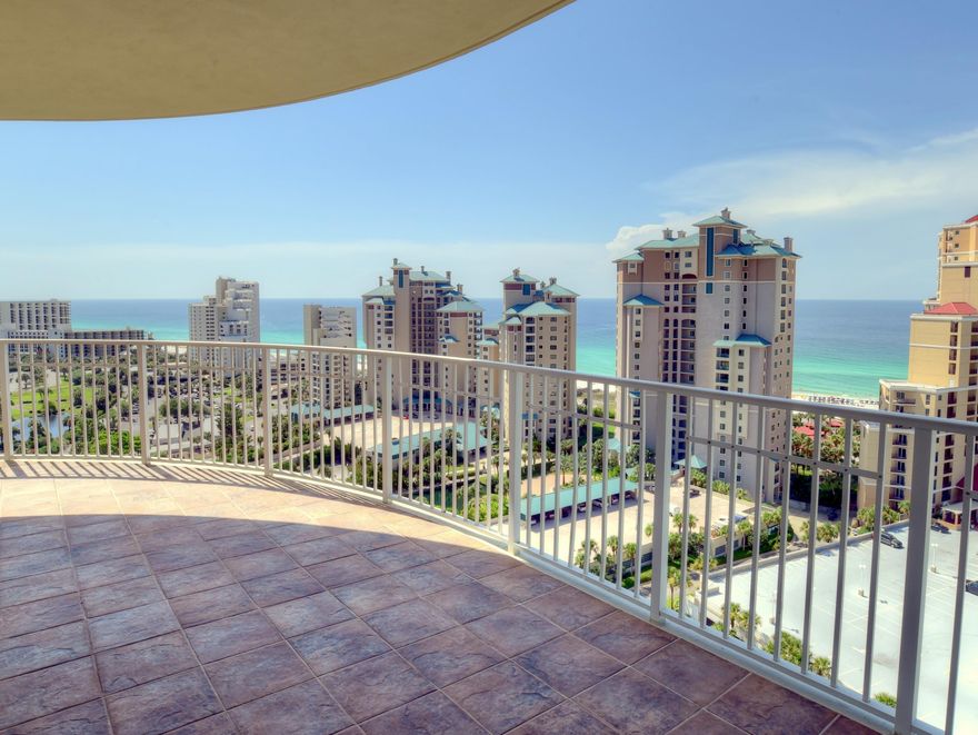 There is no more open floor plan than this one in One Beach Club. You can see from the beach to the bay when you enter the living area of this fabulous condo with 10 foot ceilings and you will feel as though you are on the top of the world. Glass walls surround you and beautiful views are everywhere to be enjoyed. Your master bedroom has soothing views of the Gulf and your two guest bedrooms have wonderful bay views and entrances onto the bay balcony. Your master opens onto the Gulf side balcony. Each bedroom has it's own private bath and there is a powder bath as you enter the home.One Beach Club is a Magnificent building loaded with amenities such asa super pool area including guest suites owners can use for just the cleaning fee. The building has a workout room, a media room