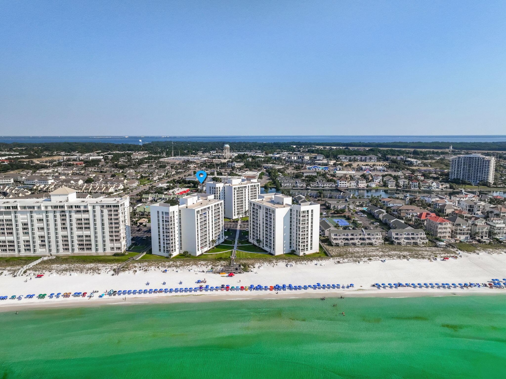 The ONLY ONE AVAILABLE! Purchase for only 10% down! Privately gated beach and Waterfront living at its finest! Welcome to PERFECTION! This is a beautifully updated waterfront townhome located in the highly desirable, gated community of Shoreline Towers on Holiday Isle in Destin, Florida. This spacious 2-bedroom, 3-bath home with bonus bunk areas offers over 1,800+ square feet of living space, soaring vaulted ceilings, and stylish modern upgrades throughout.Step inside to discover a freshly renovated interior, featuring new flooring, smooth ceilings, fresh paint, updated windows and doors, a brand-new roof, water heater, and durable hardy board siding with added insulation. The home comes fully furnished, making it ideal for full-time living, a vacation retreat, or a high-performing rental investment. The main level offers an open-concept living and dining area, a fully equipped kitchen with newer storybook white cabinetry, a custom backsplash, tile floors, a breakfast nook, and access to a private courtyard. You'll also find a full bathroom, a full-size laundry room with a folding area and storage cabinets, and a cozy fireplace for cooler evenings.
Upstairs, the primary suite includes a king bed, twin bunk bed, and a twin pull-out sofa, along with a private ensuite bath. The guest suite features two queen beds and a twin-over-full bunk bed in a separate sleeping nook - perfect for families or hosting guests. Each bedroom offers ample space and privacy with its own ensuite bathroom.
Step outside to your screened-in patio, where you can enjoy serene lakefront views and peaceful mornings by the water. Just a short walk to the deeded private beach access, you'll be soaking up Destin's famous sugar-white sand and emerald-green waters in minutes.
Enjoy resort-style living with community amenities including a seasonally heated pool, lighted tennis/pickleball courts, sauna, clubhouse, fitness room, BBQ grills, and lakeside walking paths.
Ideally located in the heart of Destin, this townhome is less than 4 miles from Destin Commons and just minutes from world-class dining, shopping, golf courses, and water activities.