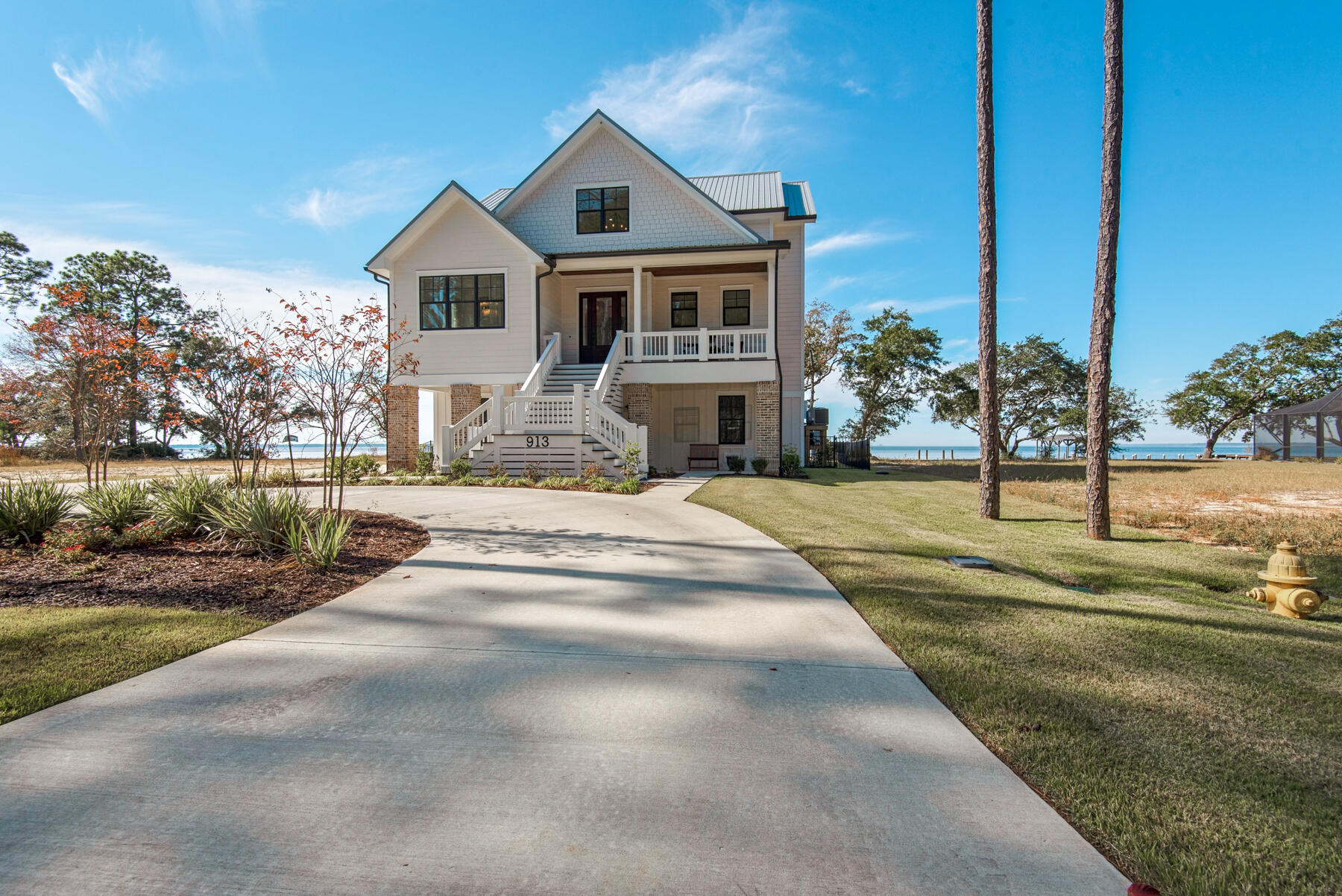 Enjoy living the Bay life in Bay Harbour! This quiet bayfront neighborhood is Freeport's best kept secret. There are no words to describe the sunsets you will experience here! This custom built home offers just over 3300 sf of living space with 4 bedrooms and 3.5 baths. The bedrooms are spacious and all have a view. Just the right amount of shiplap and reclaimed brick in the main living areas provide the charm that is so desirable. Outdoor areas are a must for waterfront living. You will find an outdoor kitchen, pool with hot tub and gas fire pit. Not to mention the dock with boat house and lift that make it so easy to hop in your boat and head out to Crab Island or for a sunset cruise.This home is a must see as there are too many extras to list!
