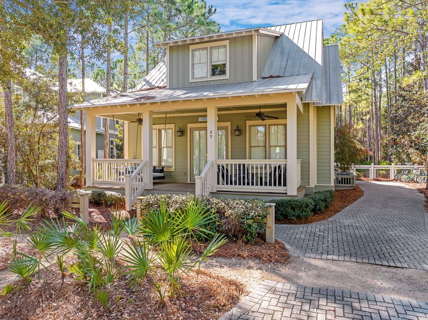Welcome to your dream coastal retreat in the heart of WaterColor, Florida! 37 Royal Fern Way is situated on an expansive lot in WaterColor, the property offers a unique opportunity to add significant value. There is ample room to construct a garage and a charming carriage house, enhancing both functionality and property value. The home features a large front porch with a cozy swing bed, perfect for enjoying the coastal breeze. The expansive back porch provides additional outdoor living space, ideal for dining al fresco or relaxing after a day at the beach. This property offers your own private oasis as you will enjoy the luxury of having one of the largest private pools in WaterColor right in your backyard, a perfect spot for relaxation and entertaining. The adjacent hot tub offers a serene place to unwind, while the outdoor shower adds convenience after beach outings. With a peaceful setting, the property backs onto a tranquil wooded area, providing privacy and a picturesque natural backdrop. This exquisite 4-bedroom, 3.5-bathroom beach house offers the perfect blend of luxury, comfort, and potential for future enhancements. WaterColor is a highly sought-after vacation destination, and this property has a strong track record of rental income. Investing in this home not only provides a luxurious personal retreat but also offers the opportunity for substantial rental revenue. With four generously sized bedrooms including a first-floor mini master suite with an ensuite bath, a second floor master suite with large master bath to include a water closet, dual vanities, a soaking tub and stand-alone shower, an additional 2nd floor guest bedroom and a dedicated bunkroom that comfortably accommodates six, making this property perfect for hosting additional guests or creating a fun space for children and a 3rd full bathroom completes the upstairs. This 2,362 square foot home provides ample space for family and guests. The residence boasts high ceilings and gleaming wood floors throughout, creating an airy and inviting atmosphere. The home's design emphasizes natural light, creating bright and cheerful living spaces.  Culinary enthusiasts will appreciate the modern kitchen equipped with granite countertops and stainless steel appliances, a central work island, and a breakfast bar, ideal for casual dining and entertaining. For more formal gatherings, the home features a dedicated dining room that offers a refined space to host family dinners and celebrations. This residence is being sold fully furnished, allowing you to move in and start enjoying the WaterColor lifestyle immediately. This property is located in the resort neighborhood of Watercolor, nestled between the stunning Gulf coastline and serene Western Lake. WaterColor offers a unique blend of beach and lakefront living and is renowned for its beautifully preserved natural landscapes. As a resident of WaterColor, you will have access to an array of exceptional upscale amenities. WaterColor is home to 9 community pools, including three offering unobstructed Gulf views at the Watercolor Beach Club and three at Camp WaterColor featuring two pools with slides, a lazy river, playground, and basketball court. Throughout Watercolor you will find 5 miles of hiking and biking trails, multiple park areas and several docks that are great to let the kids fish in. The community is designed to have a small-town feel and is perfect for exploring on foot or by bike. Quaint streets and pathways connect homes to the community's parks, lush green spaces and shops. Resident also have access to both tennis and pickle ball courts and a pro shop with tennis gear. Private lessons, group clinics and other activities are available throughout the year. The community also includes access to a boathouse on Western Lake with paddle boards, kayaks and fishing equipment; an outdoor amphitheater; a lakeside pool; and a bike barn. This property is more than just a home; it is an opportunity to embrace the coveted WaterColor lifestyle while adding your personal touch. Don't miss the chance to make this exceptional beach house your own!