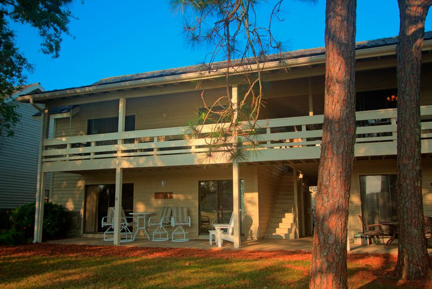 Step into this completely renovated second level two bedroom villa and enjoy the Seascape lifestyle. The kitchen has a contemporary flair and includes stainless appliances, open shelving, beautiful gray cabinets and tile floors. This villa is very well appointed with tile and laminate flooring, new lighting, fixtures, furnishings, and newly remodeled bathrooms. The color scheme throughout is inviting and flows very well. Step out onto the large balcony that runs the entire length of the villa and enjoy the peaceful view of the 13th fairway and a serene pond. This villa also includes a washer and dryer and is being offered completely furnished and rental ready. Rental history is available. This villa is just a short walk to the beautiful beaches, community pools, golfing and tennis.