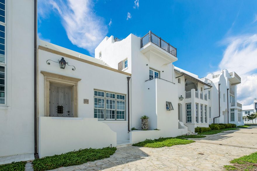 From famed Melanie Turner Interiors comes an exquisitely furnished, turnkey residence just steps from the private, crystalline shores of Alys Beach. Artfully designed by architect Gary Justiss and carefully built by Davis Dunn construction, 20 Shinbone Ct merges the simple joys of beach living with the luxuries of a full-time home. Such luxuries include an entertaining kitchen equipped with the enviable butlers pantry and storage, two gas fireplaces on the main floor, two laundry facilities, an elevator and an abundance of large closets throughout. Enter on the main floor and enjoy open-concept living offering multiple lounge areas with soaring 12' ceilings; throw open three french doors to a private courtyard with newly renovated pool and spa to marry indoor-outdoor living; wile away afternoon hours in the protected outdoor lounge, newly renovated to offer air conditioning for summer months and a fireplace for winter; retreat to the sumptuous master on main with electronic blackout roman shades and en-suite bath with laundry. 

Upstairs, find a second floor lounge and kitchenette (complete with dishwasher) serving three additional bedrooms each equipped with attached baths. Though sufficiently private for movie screenings or afternoon naps, the second floor can serve as additional entertaining and living spaces. Fittingly, the second floor has been designed for both. 

Venture another floor up - or take the elevator which serves all three floors - and arrive at the jewel of the property: a rooftop terrace offering unobstructed views of the unfathomably blue waters and white sands of the Gulf of Mexico. During summer months, host rooftop parties with its summer kitchen, dining and lounge areas; and, during the mild winter days and nights, sit fireside to enjoy cool ocean breezes.   

20 Shinbone Court offers the discerning buyer a seamless transition into the coveted and luxurious Alys Beach lifestyle, with its many amenities, including the homeowner-exclusive Beach Club at Alys, just a short stroll down the Sea Garden pedestrian path. 
