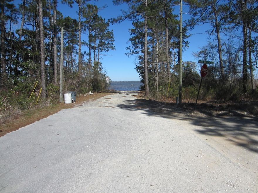 Bayfront (two lots) with 102 feet of frontage. Lots are sold together. Electric, Water & Sewer available to the lots. Terrific views across the Bay. Excellent location close to schools, 30A, and public access. Quiet Water Trail is a 20 foot wide unpaved road adjacent to lots on North side. Buyer Due diligence should include wetlands determination, etc. Some permitting will likely be required by COE and/or FDEP.