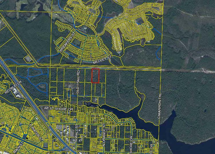 Great investment for more than 5 acres of land. This area is poised for growth. Some of the only large tracts of land left vacant near the beach. Better hurry!!