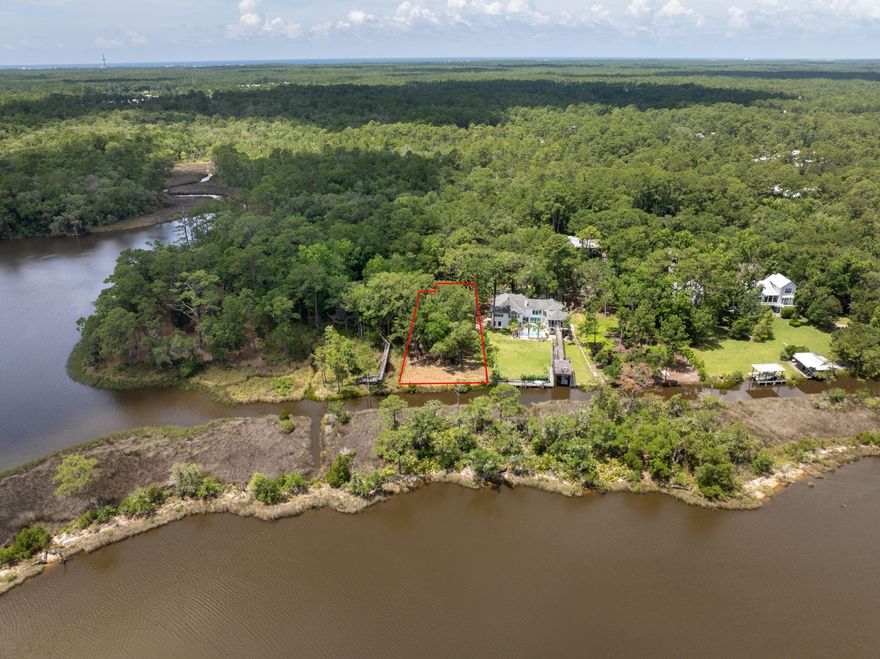 An exceptional opportunity to build in one of Point Washington's most exclusive waterfront enclaves. This oversized canal front homesite spans just over half an acre and offers approximately 95 feet of water frontage with direct access to access to the inter coastal waterway, Choctawhatchee Bay, and Tucker Bayou. Nestled beneath a canopy of serene oaks and magnolias, the setting offers both privacy and natural beauty ideal for a custom coastal retreat.Located just minutes from 30A, Grayton Beach, Seaside, WaterColor, and the sugar white sands of the Gulf, you'll enjoy effortless access to dining, boutique shopping, and our iconic beach communities. Buyer to verify all dimensions.
