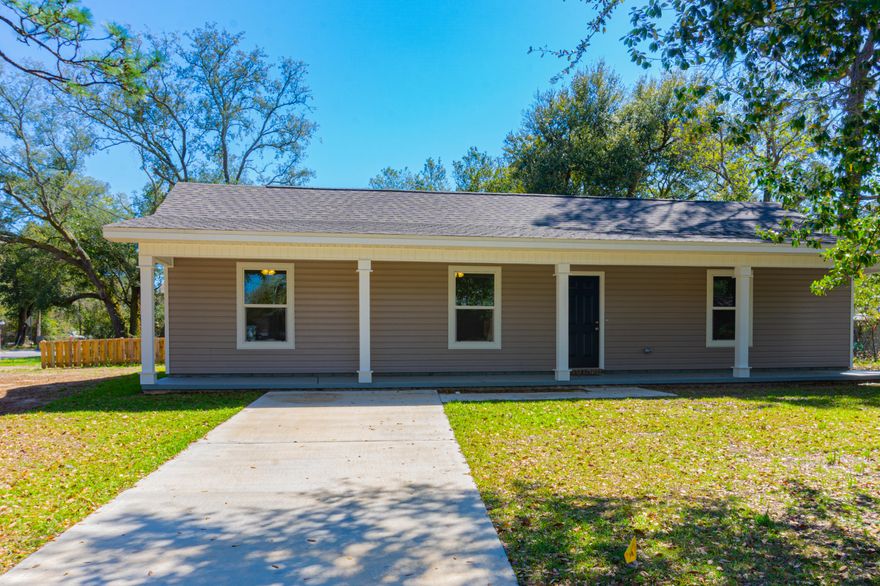 Beautiful new construction home situated on a corner lot.  This cottage home offers a 300 square foot front porch over looking the front yard with mature trees.  Inside you'll luxury vinyl plank flooring through out. The large living room will allow for oversize furniture.  The kitchen has custom wood cabinetry, pantry, energy star rated stainless steel appliances, cooktop.  Large laundry room off the kitchen. Other features, LED lighting through out and ceiling fans in the Livings and all three bedrooms.